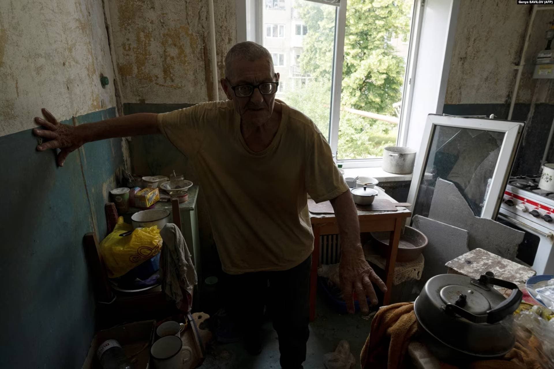 With no electricity or water, Grozdov relies on a camping stove and supplies provided by volunteer to survive