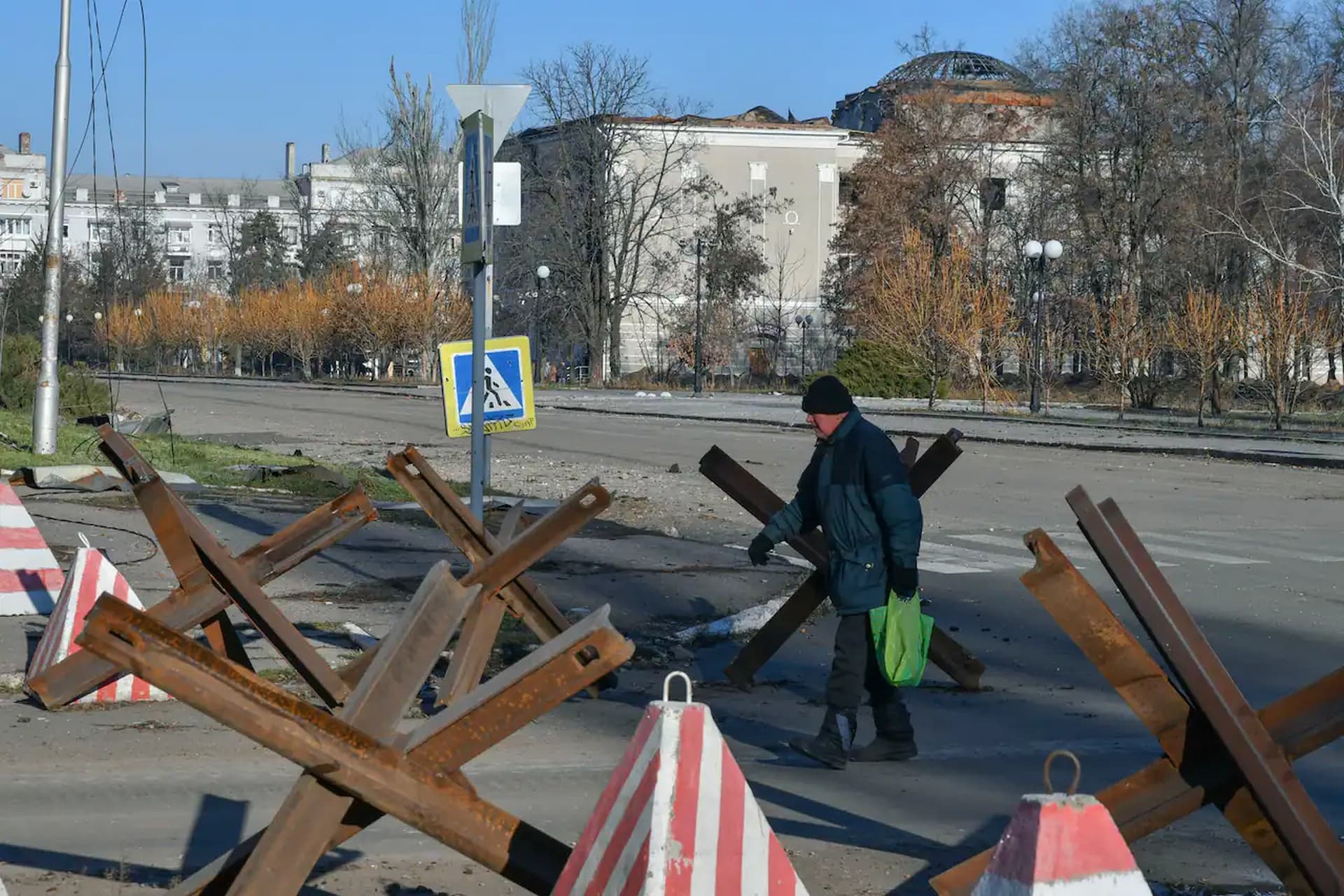 A local resident walks along a street in the area of the heaviest battles with the Russian invaders in Bakhmut