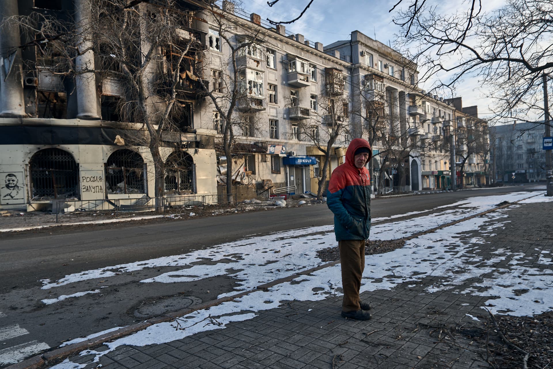 A local resident walks along a street in Bakhmut