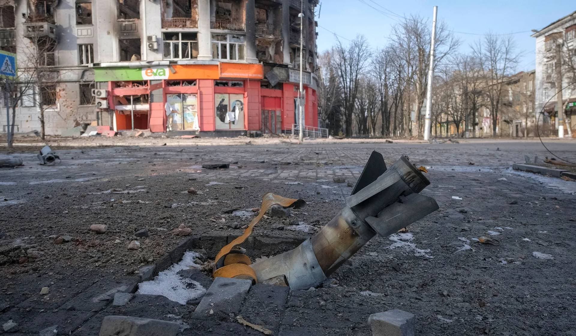 Part of a rocket near a building damaged by a Russian military strike in the front line city of Bakhmut