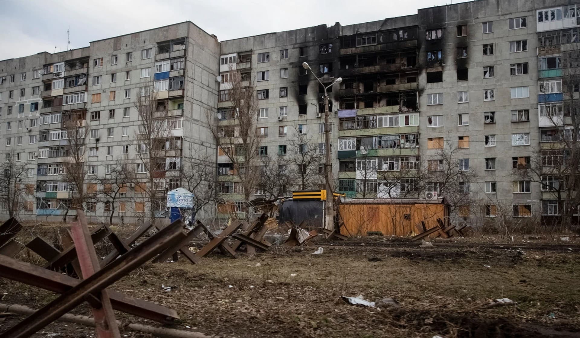A general view shows an empty street and buildings damaged by a Russian military strike in the front line city of Bakhmut