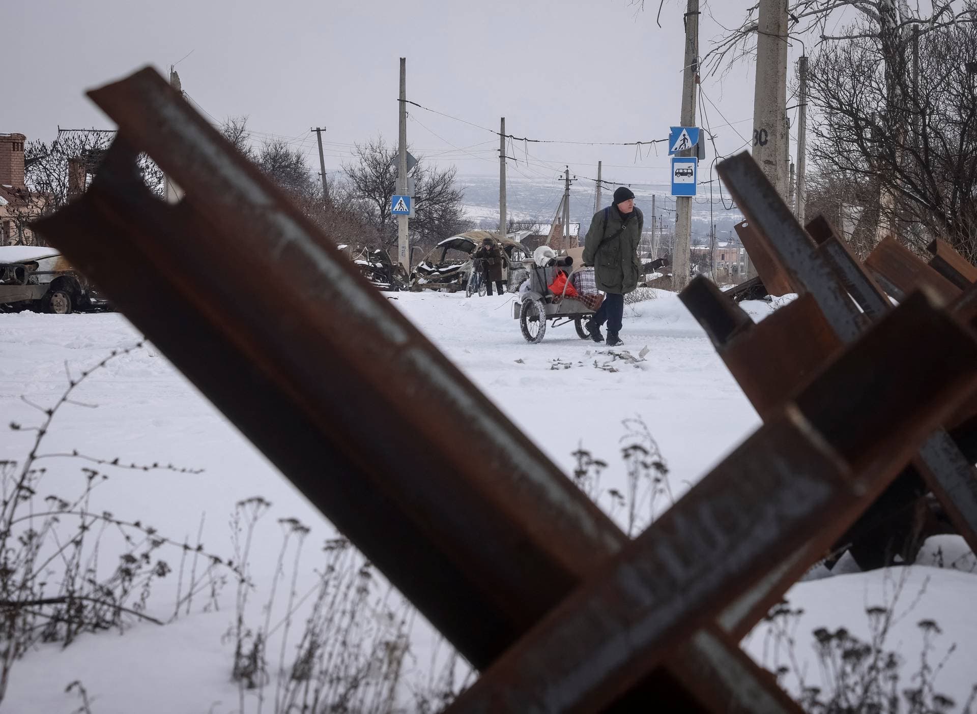 Residents walk on an empty street, as Russia’s attack on Ukraine continues, in the front-line city of Bakhmut