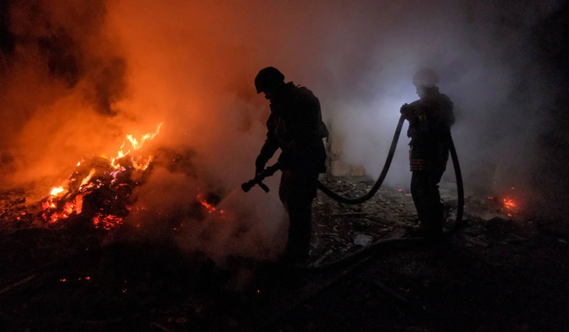 Rescuers work at a site after a Russian military strike in Chasiv Yar