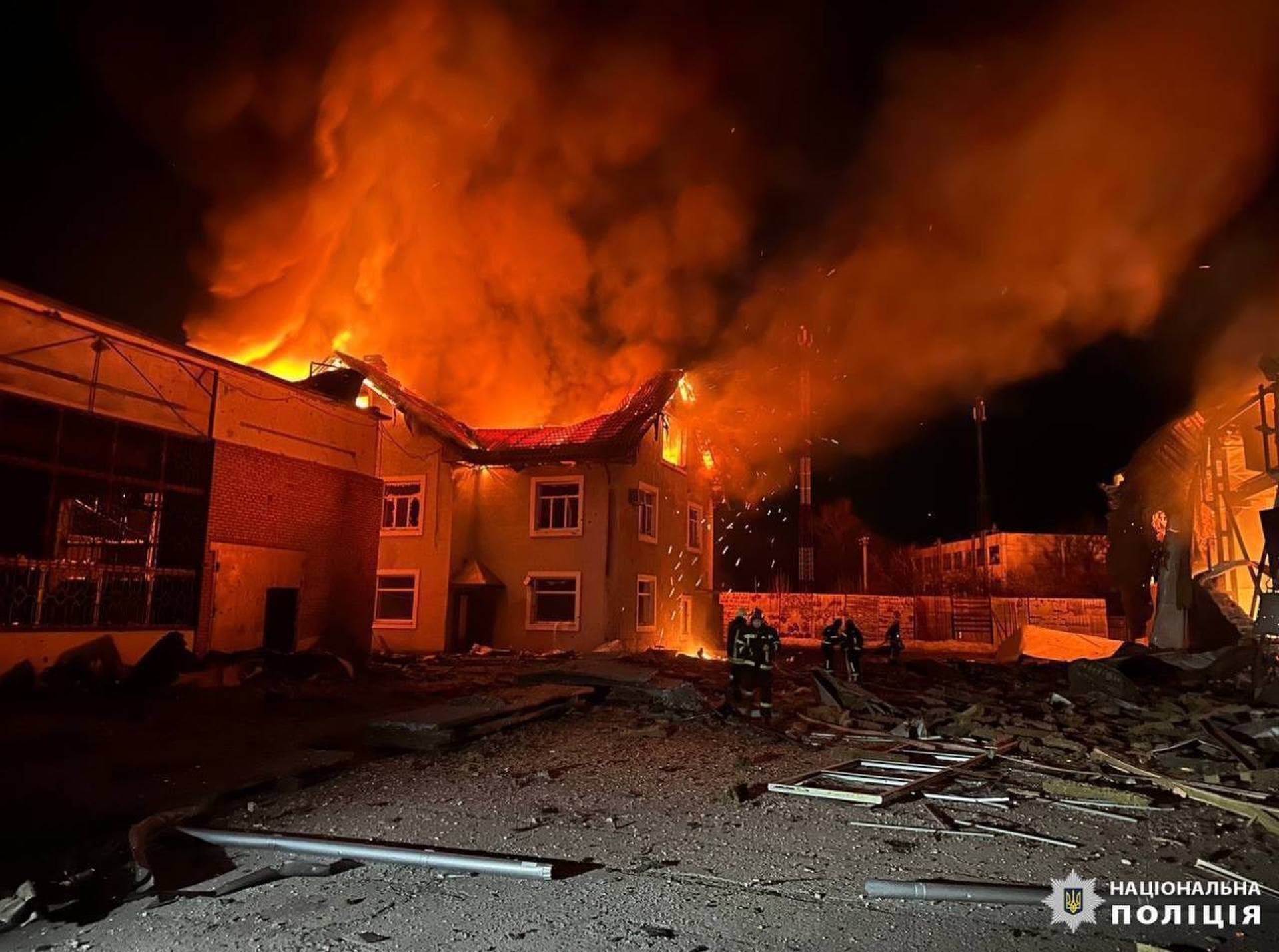 Firefighters work at a site where production facilities were damaged during a Russian drone strike near Bila Tserkva