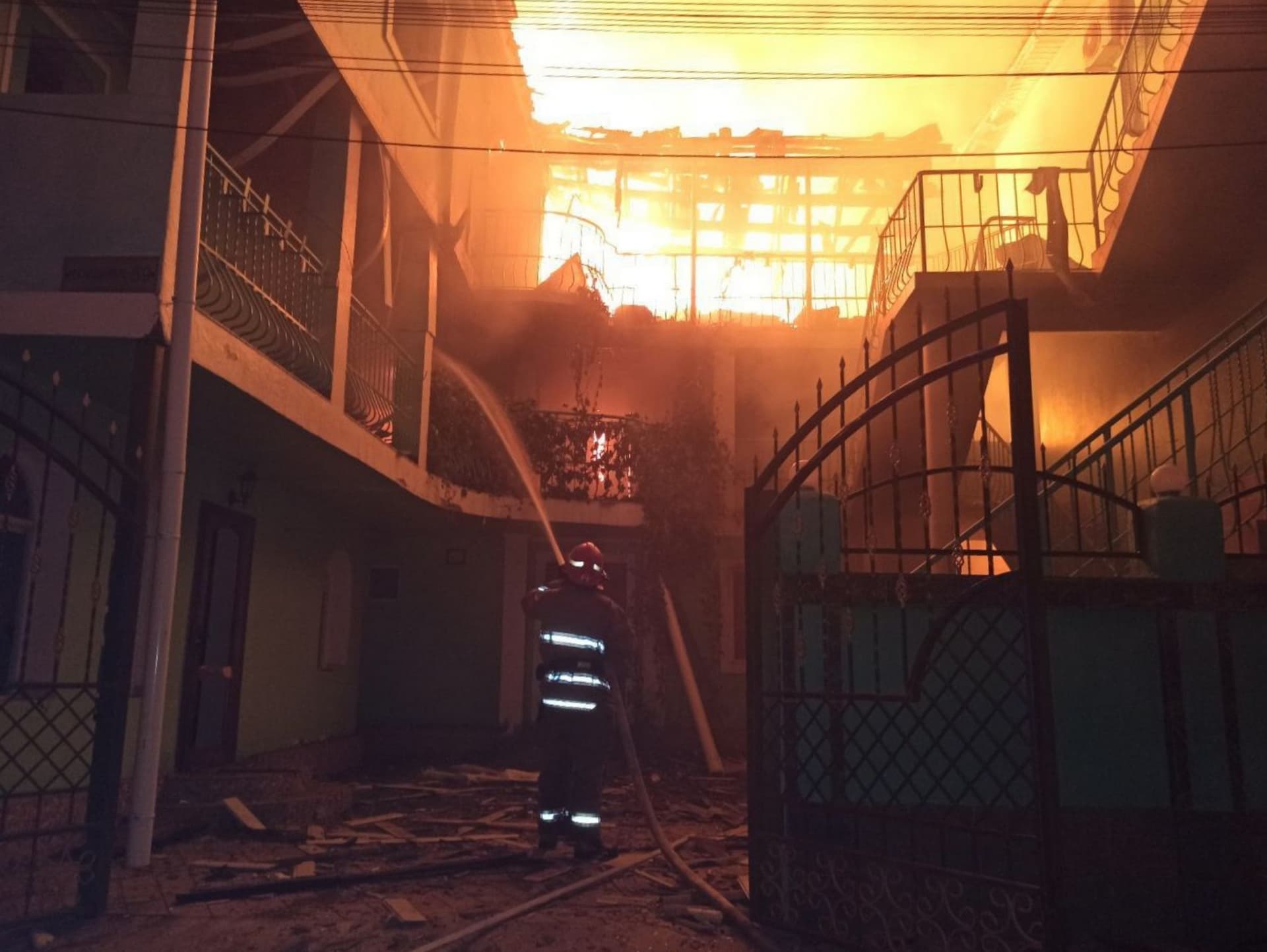 A firefighter works to contain the aftermath of a Russian attack in Zatoka