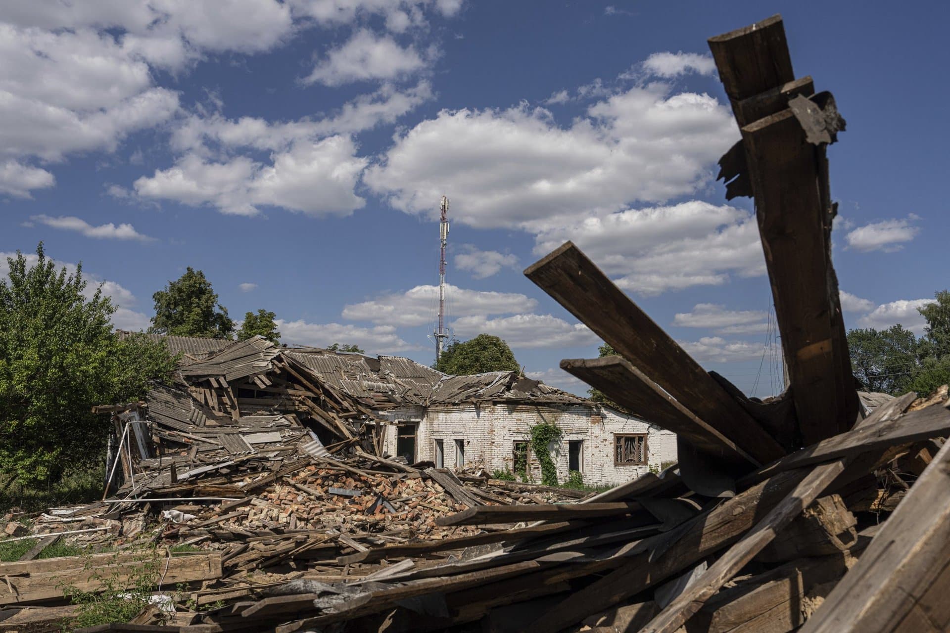 Dr. Ilona Butova walks near the therapy department which was destroyed after a Russia attack on the hospital in Zolochiv