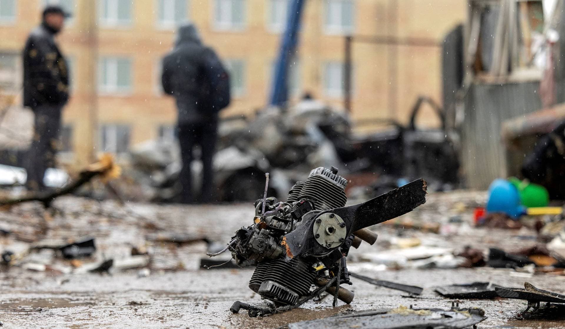 The engine of a Russian drone lies at the impact site in a residential neighborhood in Vyshneve
