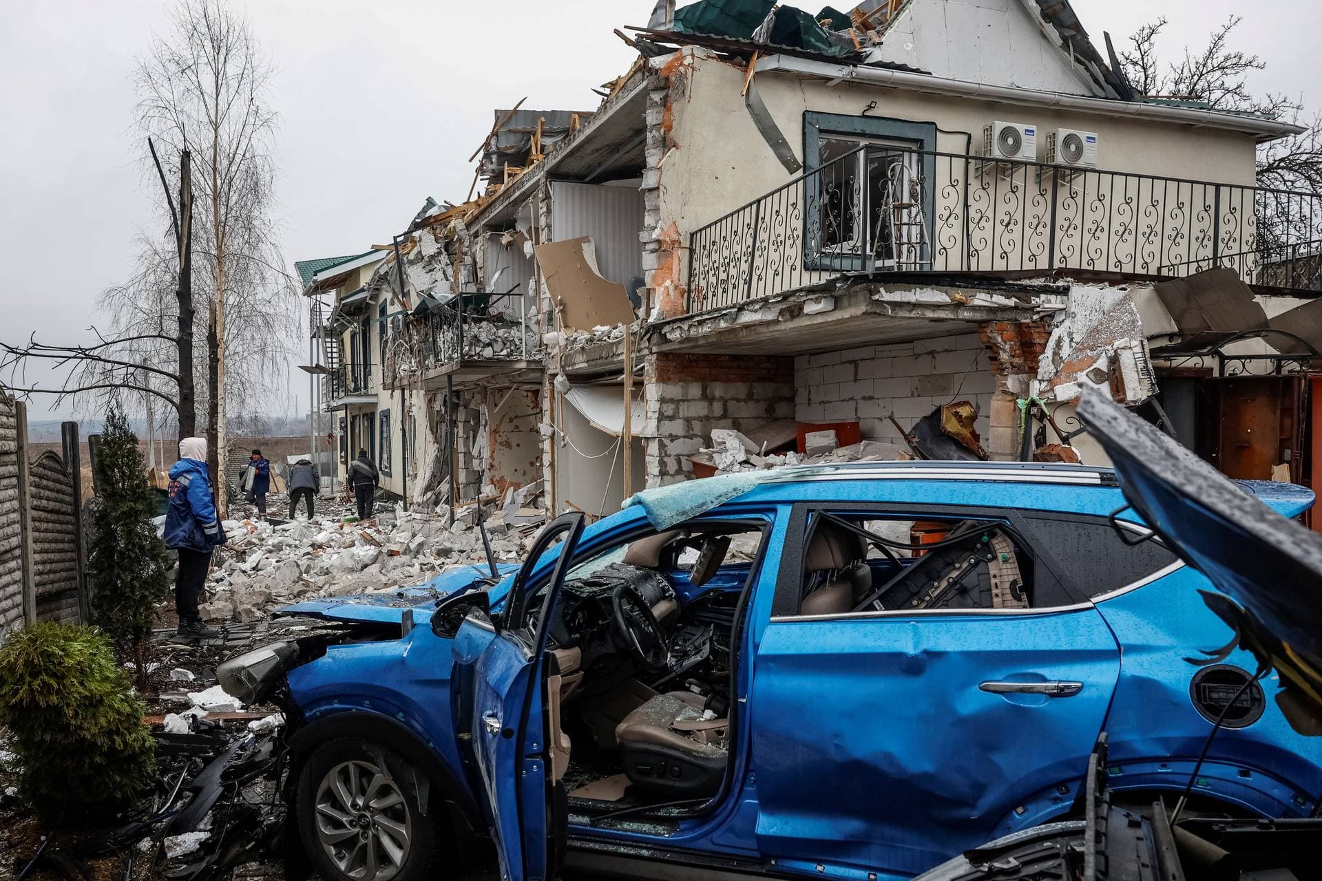 Damaged private houses and car at the site of a Russian drone strike in Hostomel