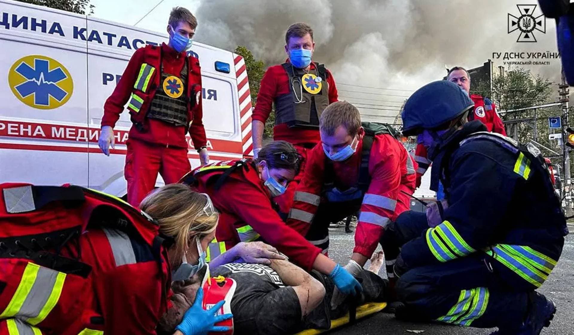 Medics work in the area that was damaged during a Russian missile strike in Cherkasy