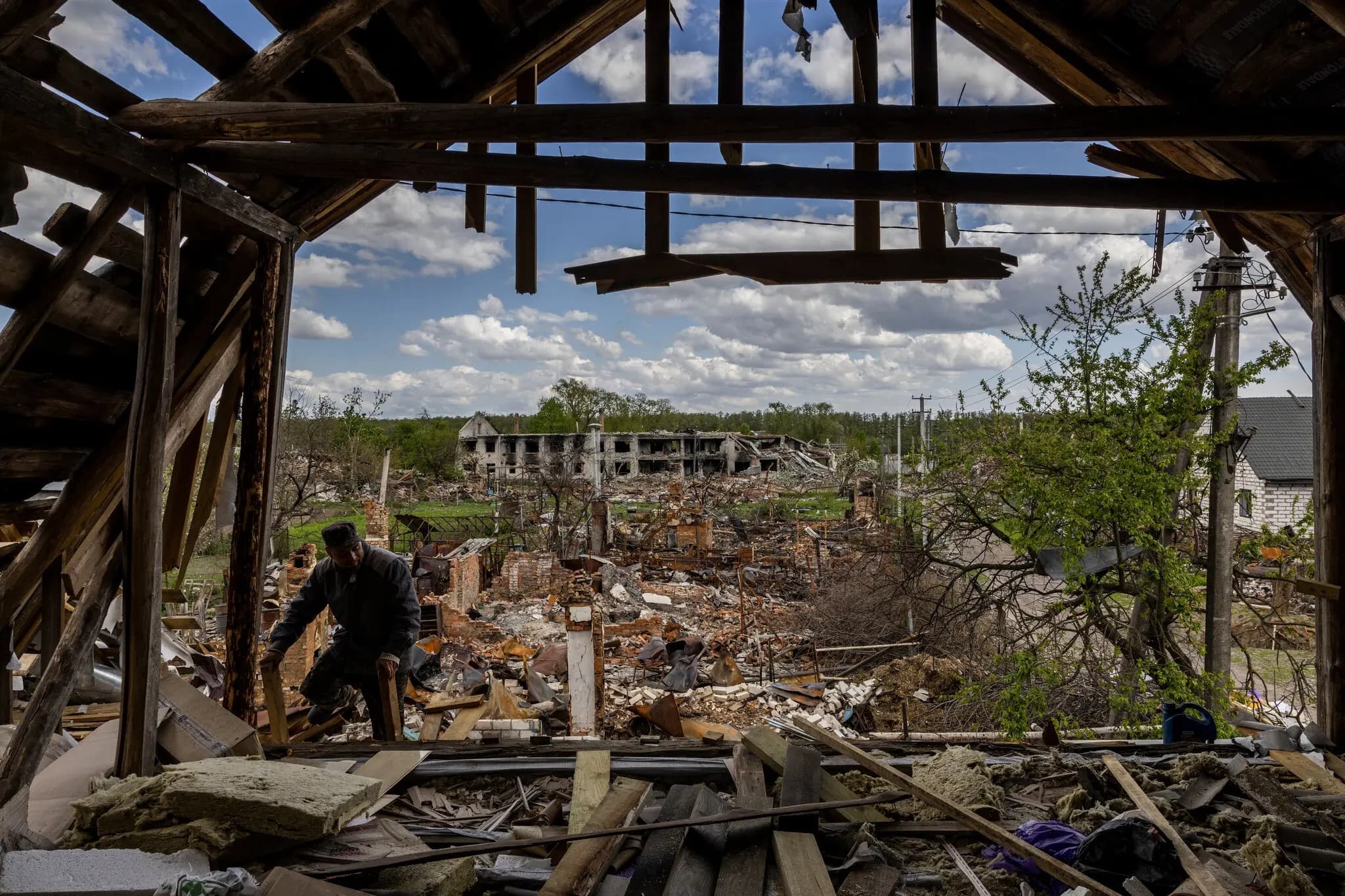 Oleksandr worked to repair the roof of his house, in Novoselivka