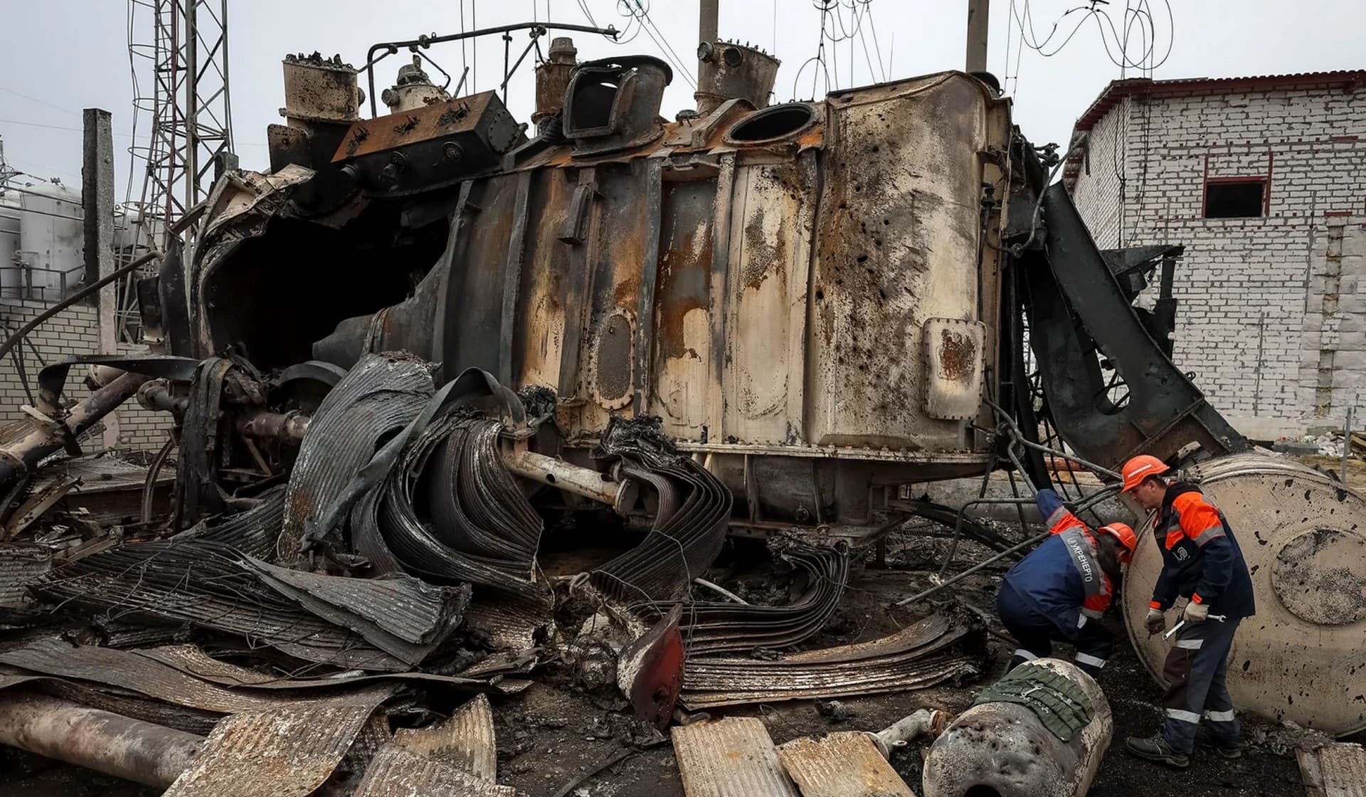 Workers at a high-voltage substation of Ukrenergo damaged in a Russian military strike in the central region of Ukraine