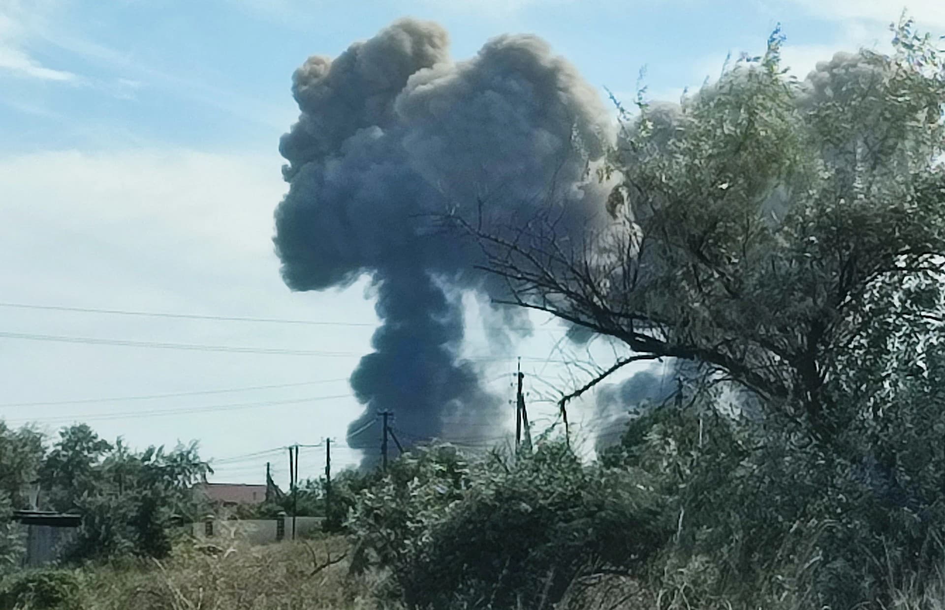 Smoke rises after explosions were heard from the direction of a Russian military airbase near Novofedorivka, Crimea