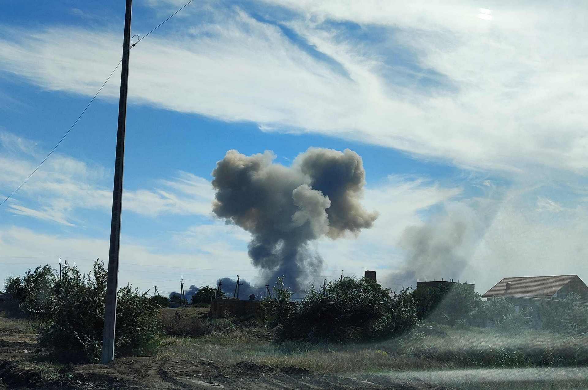 Smoke rises after explosions were heard from the direction of a Russian military airbase near Novofedorivka, Crimea