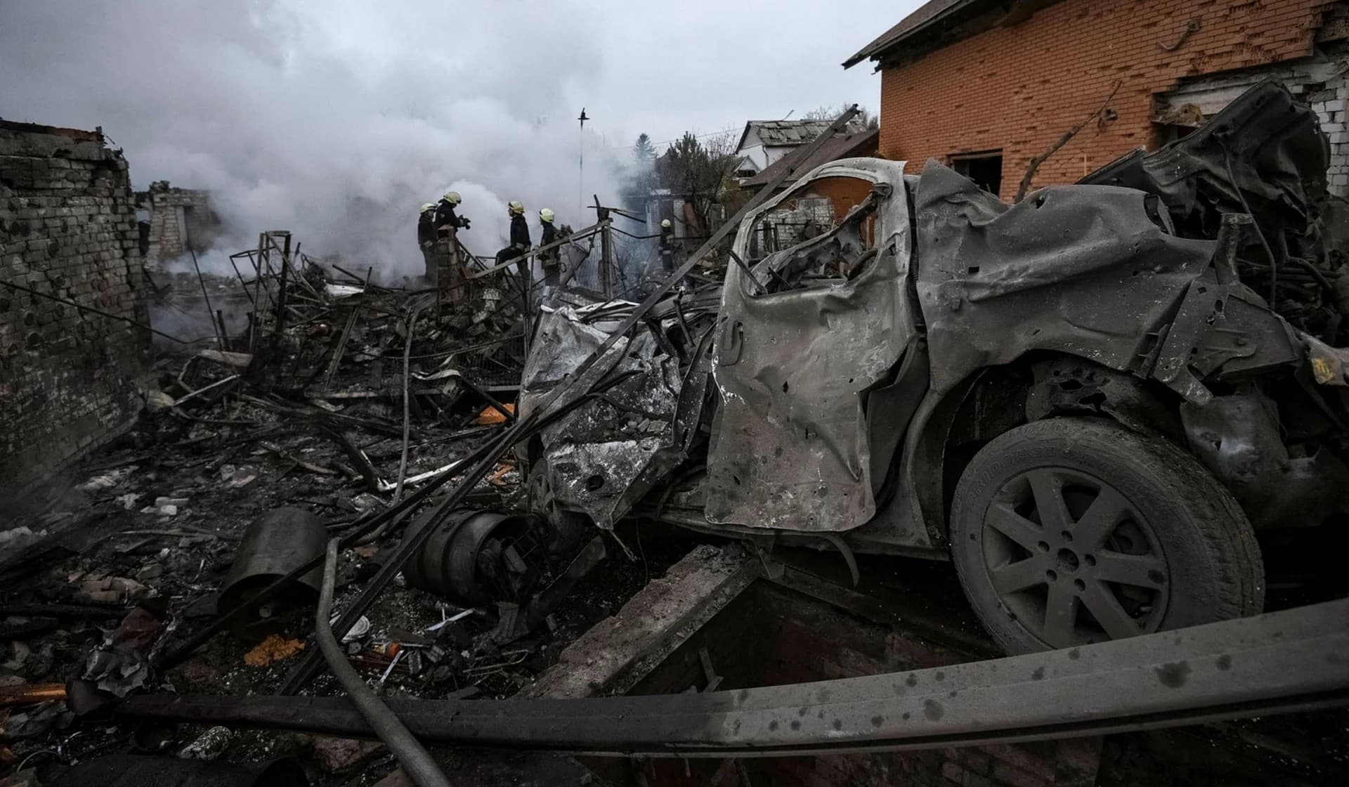 Rescuers work at a site of private houses heavily damaged by a Russian missile strike in Dnipro