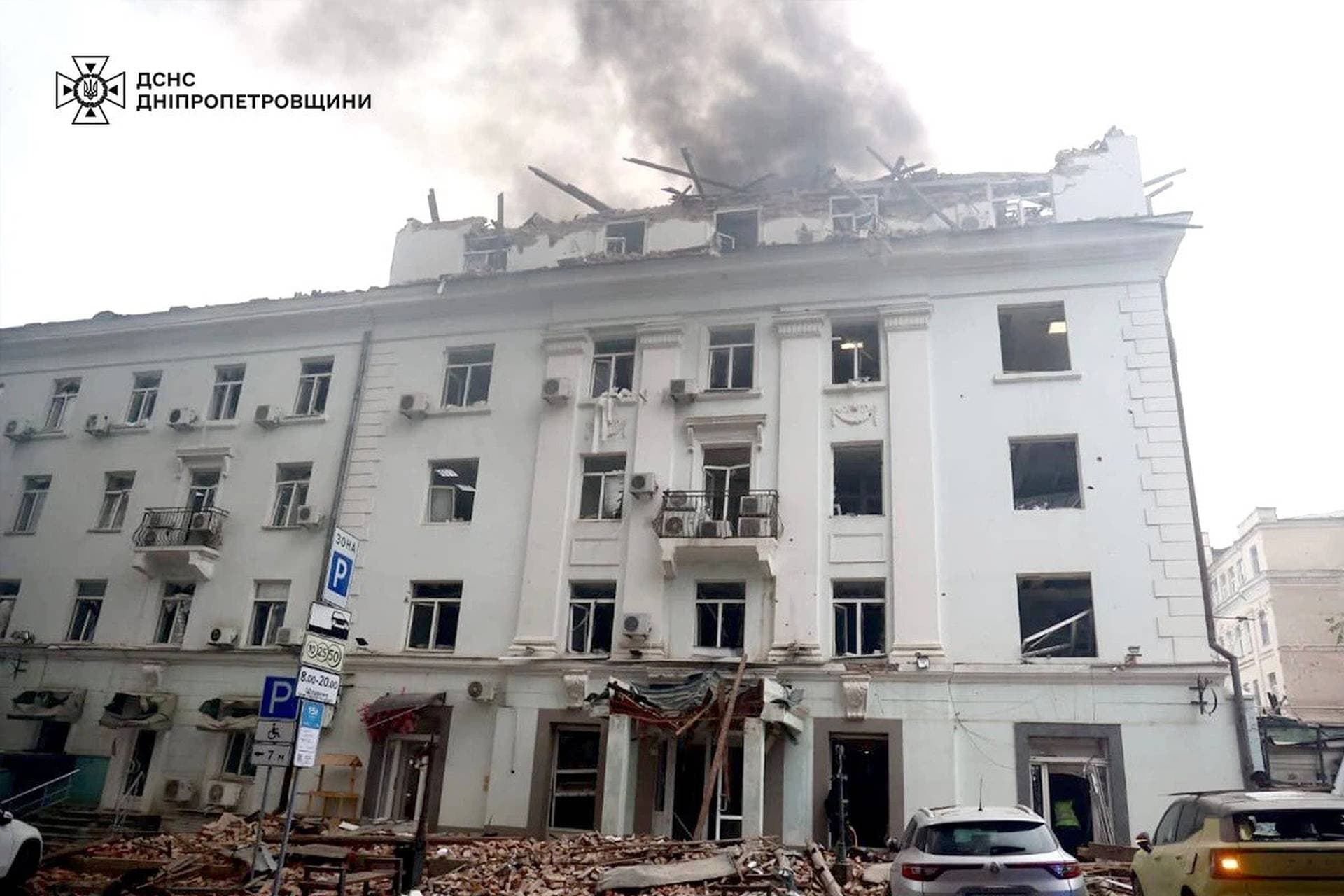 Rescuers work at the site of the Russian drone strike in Dnipro