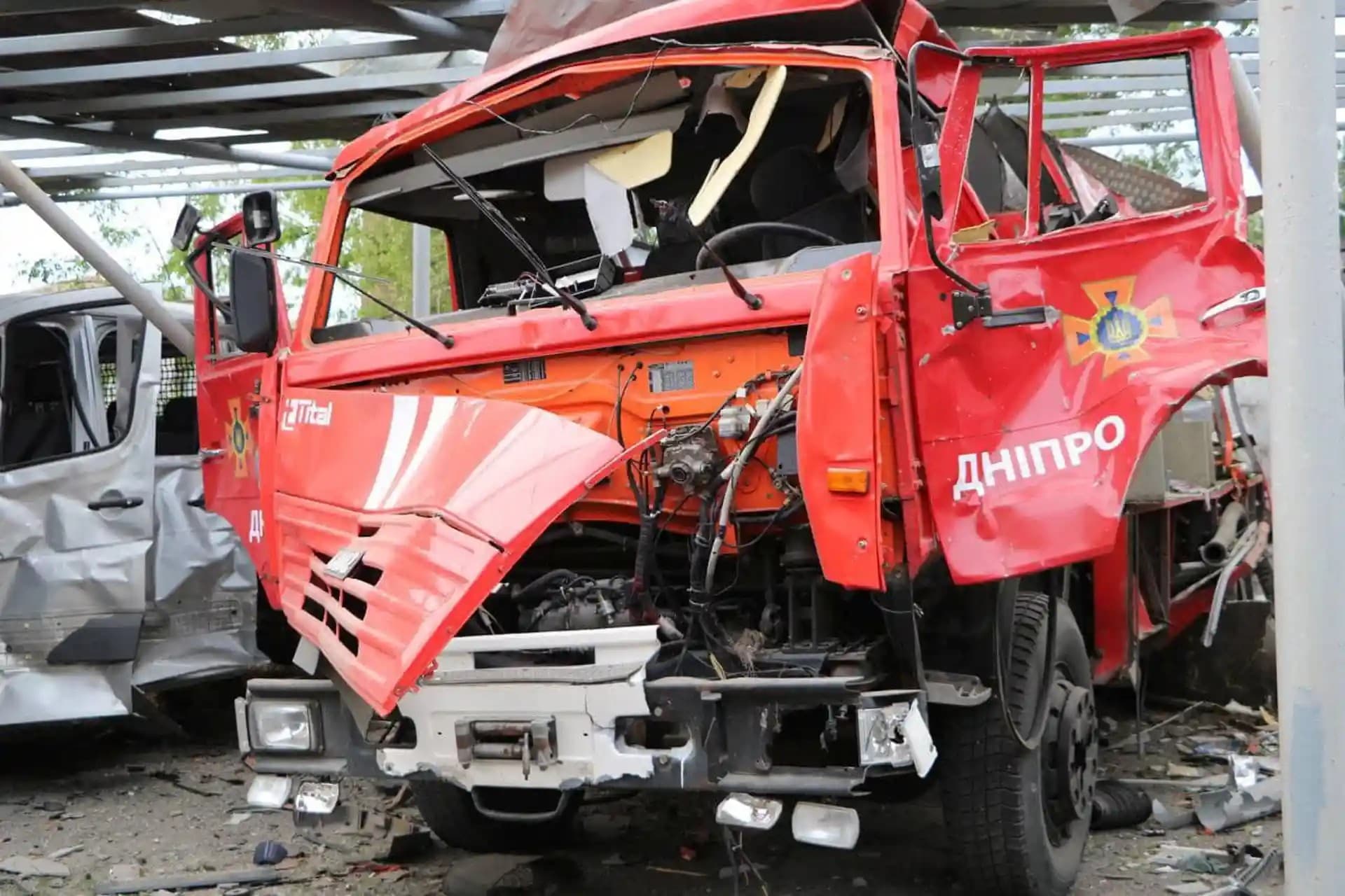 A vehicle destroyed by a strike is seen at a compound of a fire depot of the State Emergency Service