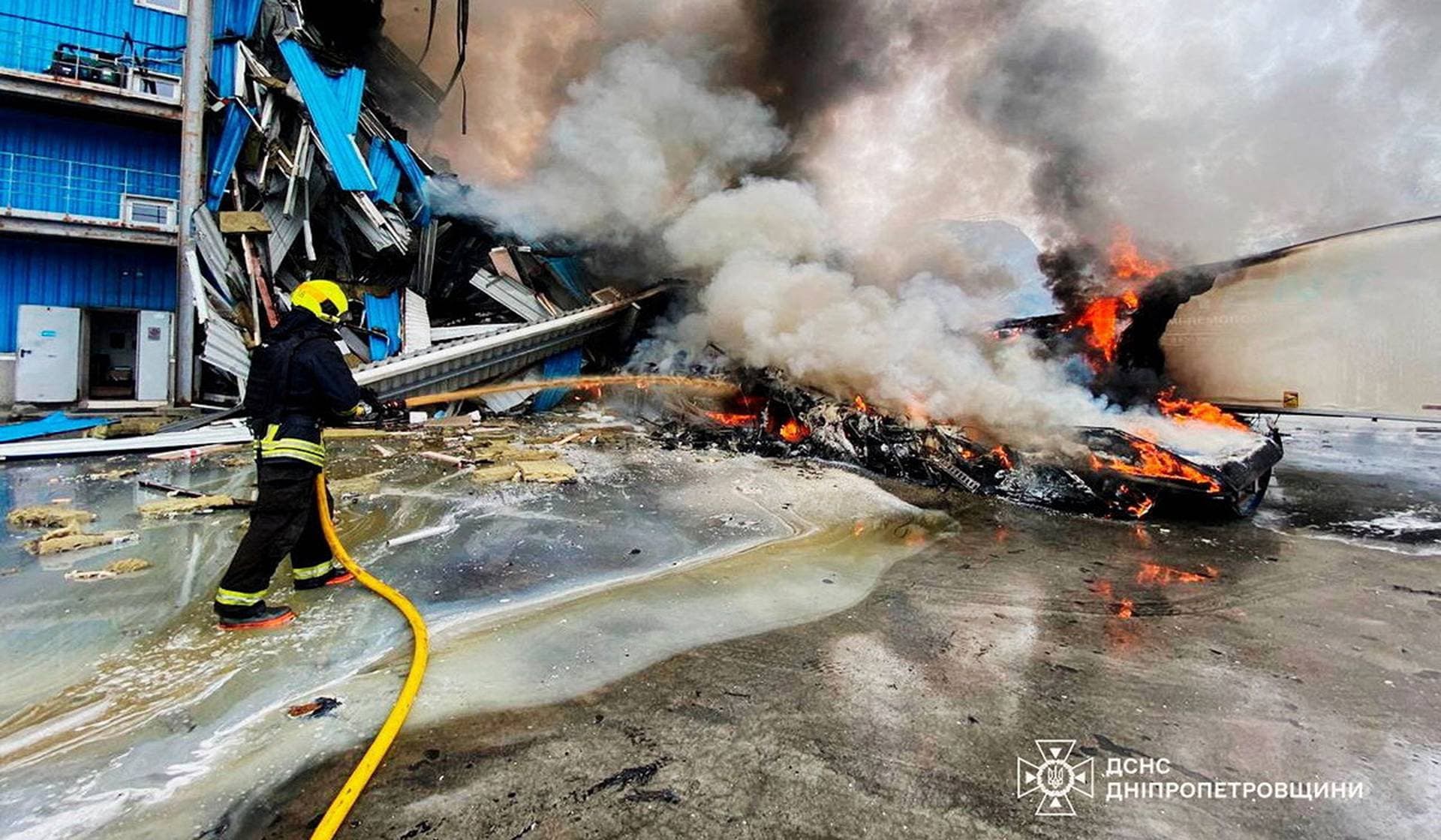 A rescuer works at a site of apartment buildings hit by a Russian drone strike in Dnipro