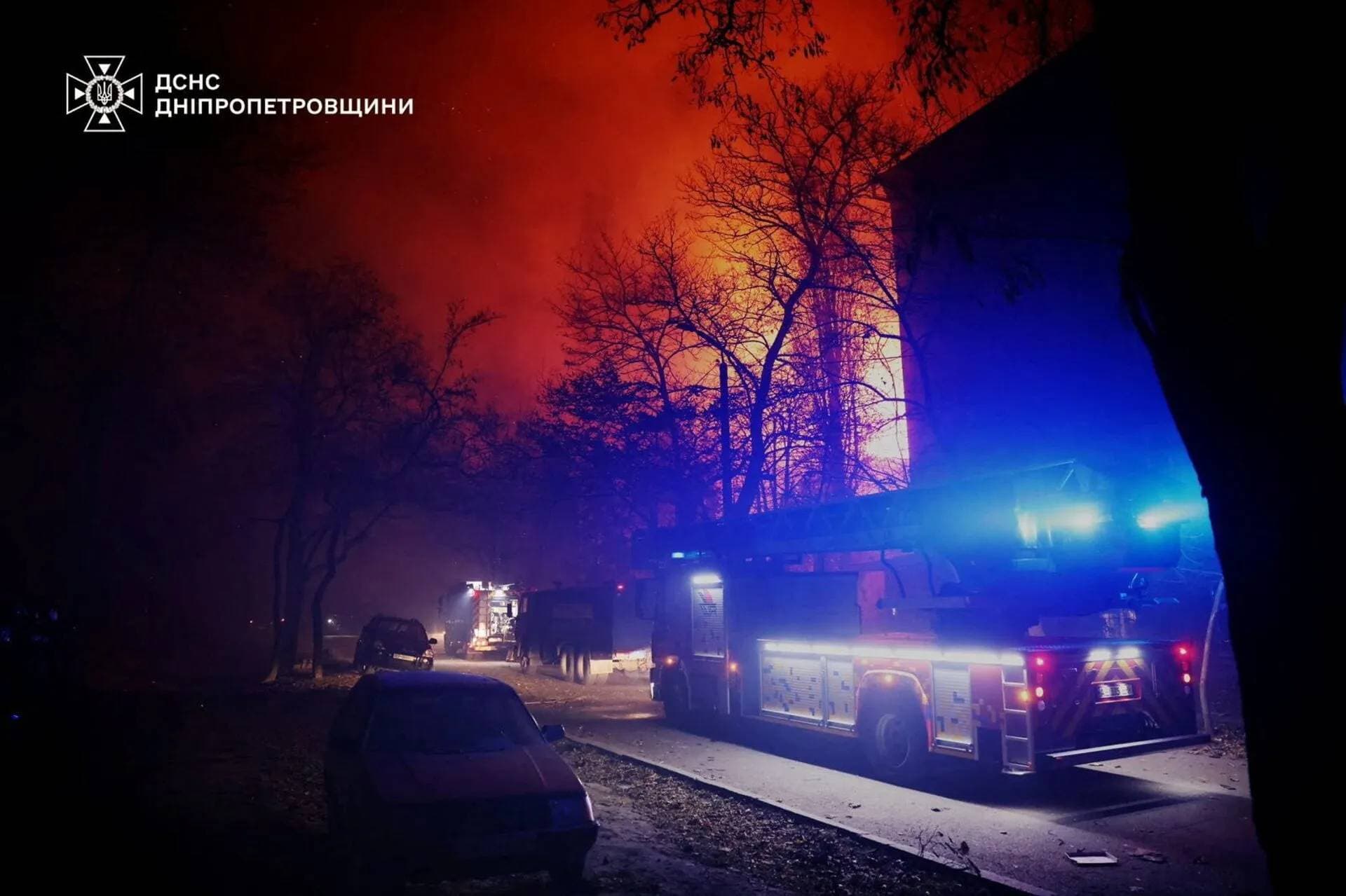 Emergency vehicles parked at the site of a Russian drone strike in Dnipro