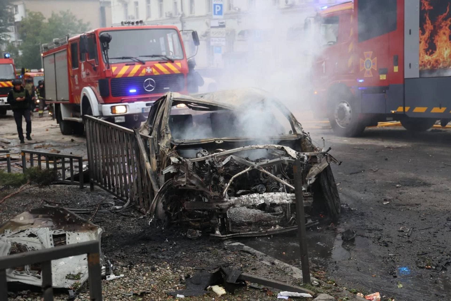 Rescuers work at the site of the Russian drone strike in Dnipro