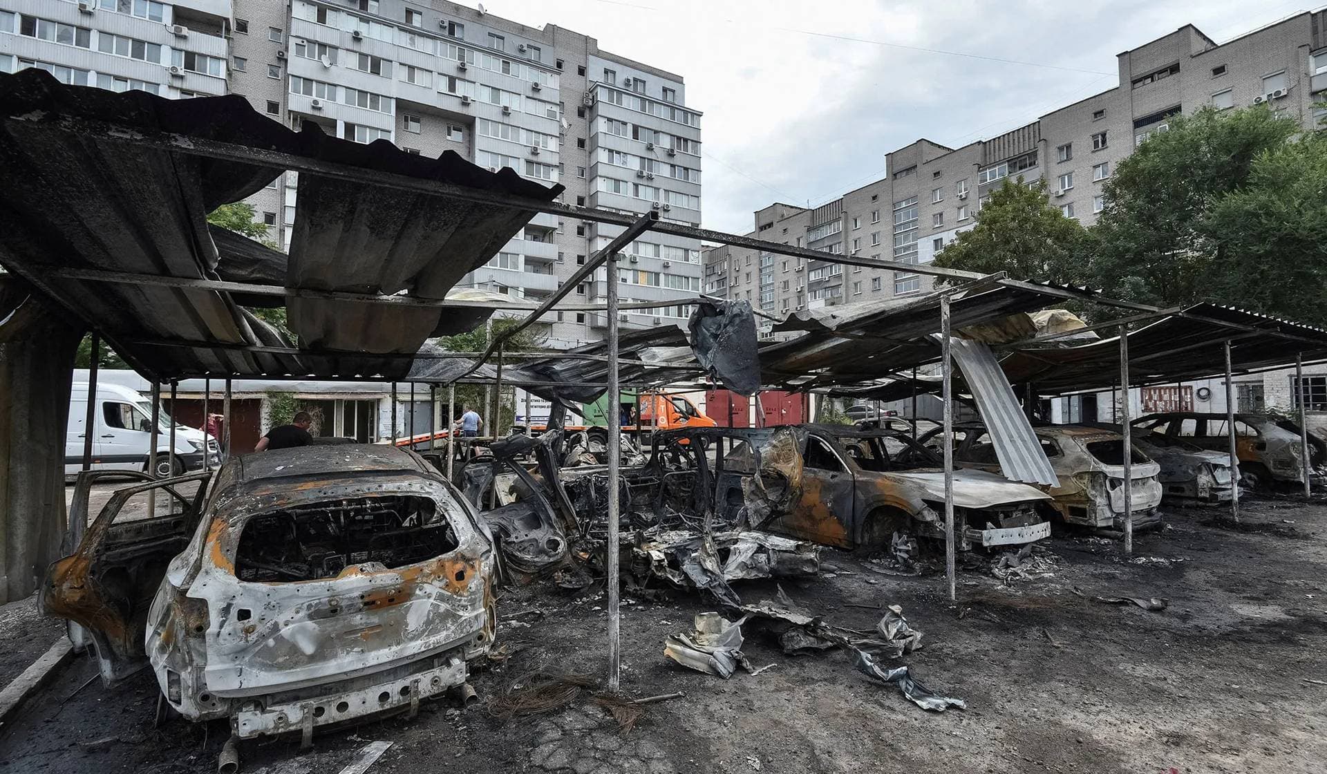 Burned cars at the site of the Russian drone strike in Dnipro