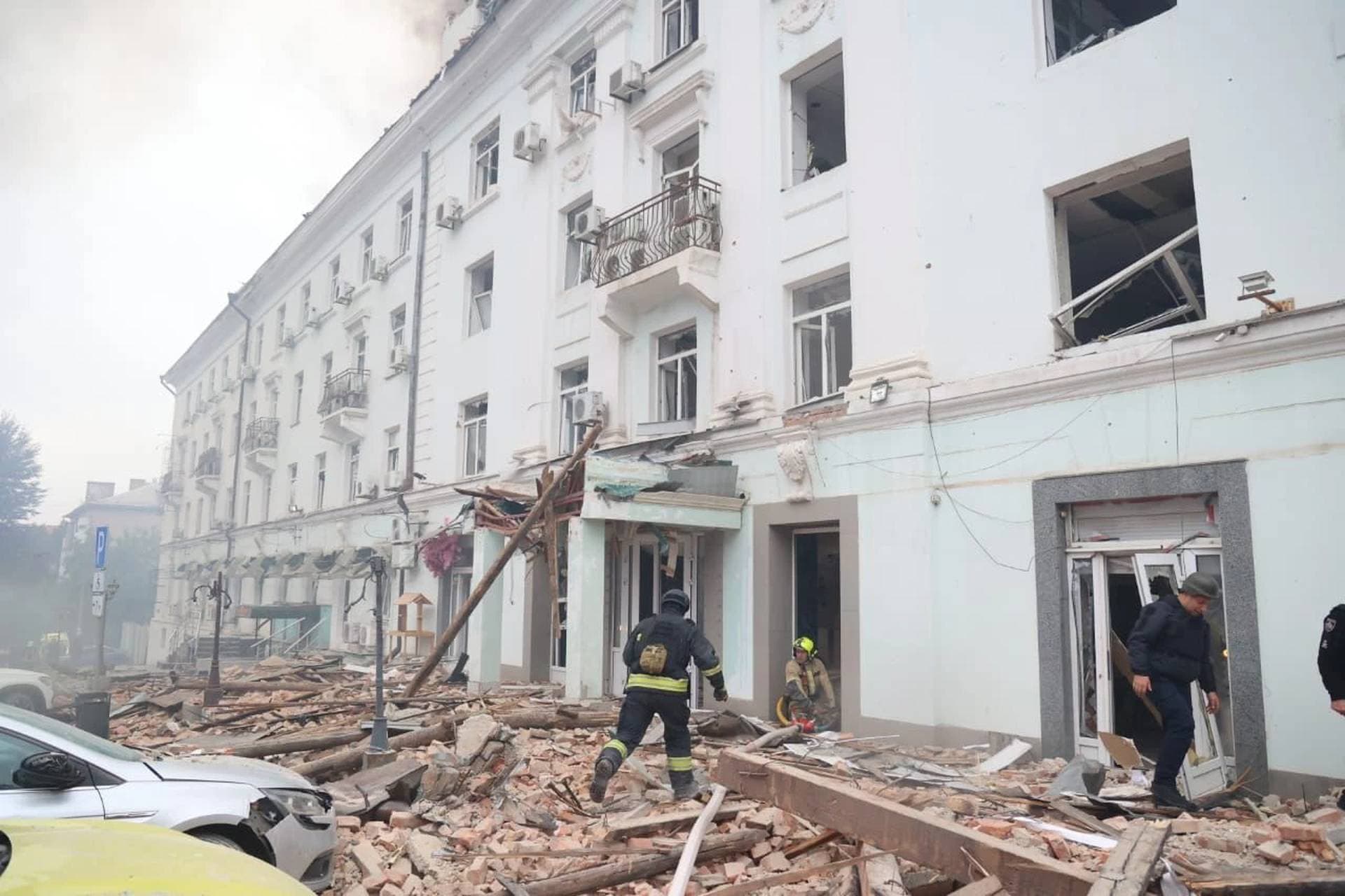 Rescuers work at the site of the Russian drone strike in Dnipro