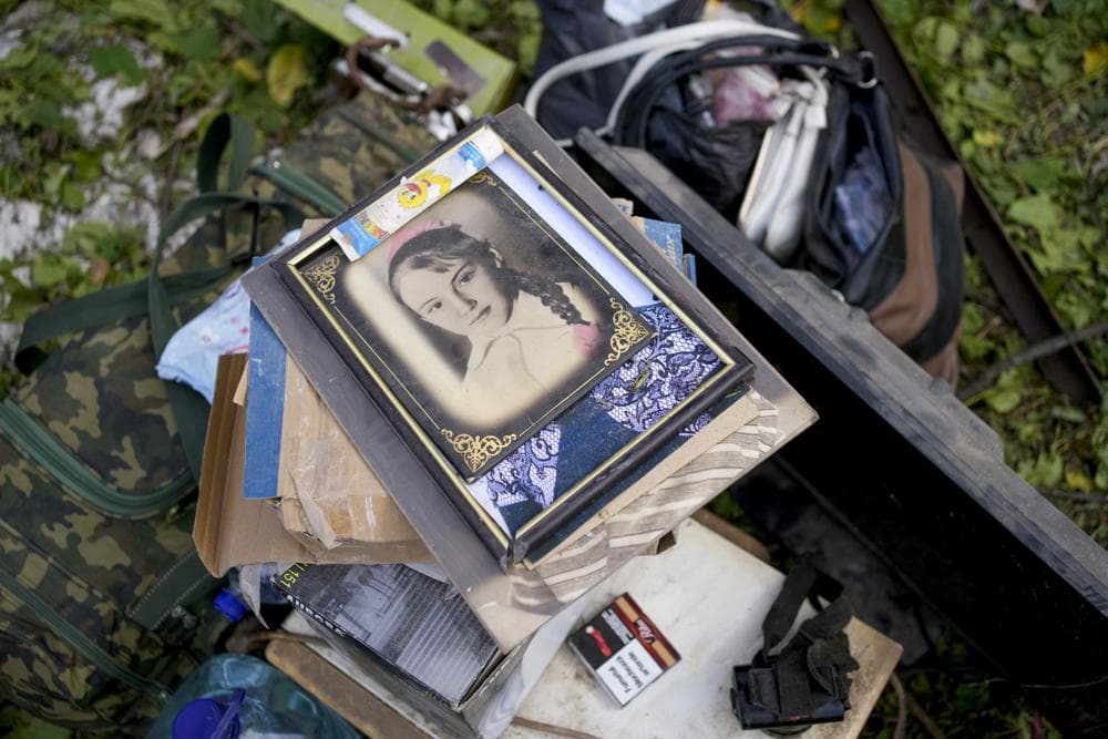 A portrait in the rubble of a damaged house after a strike in Druzhkivka