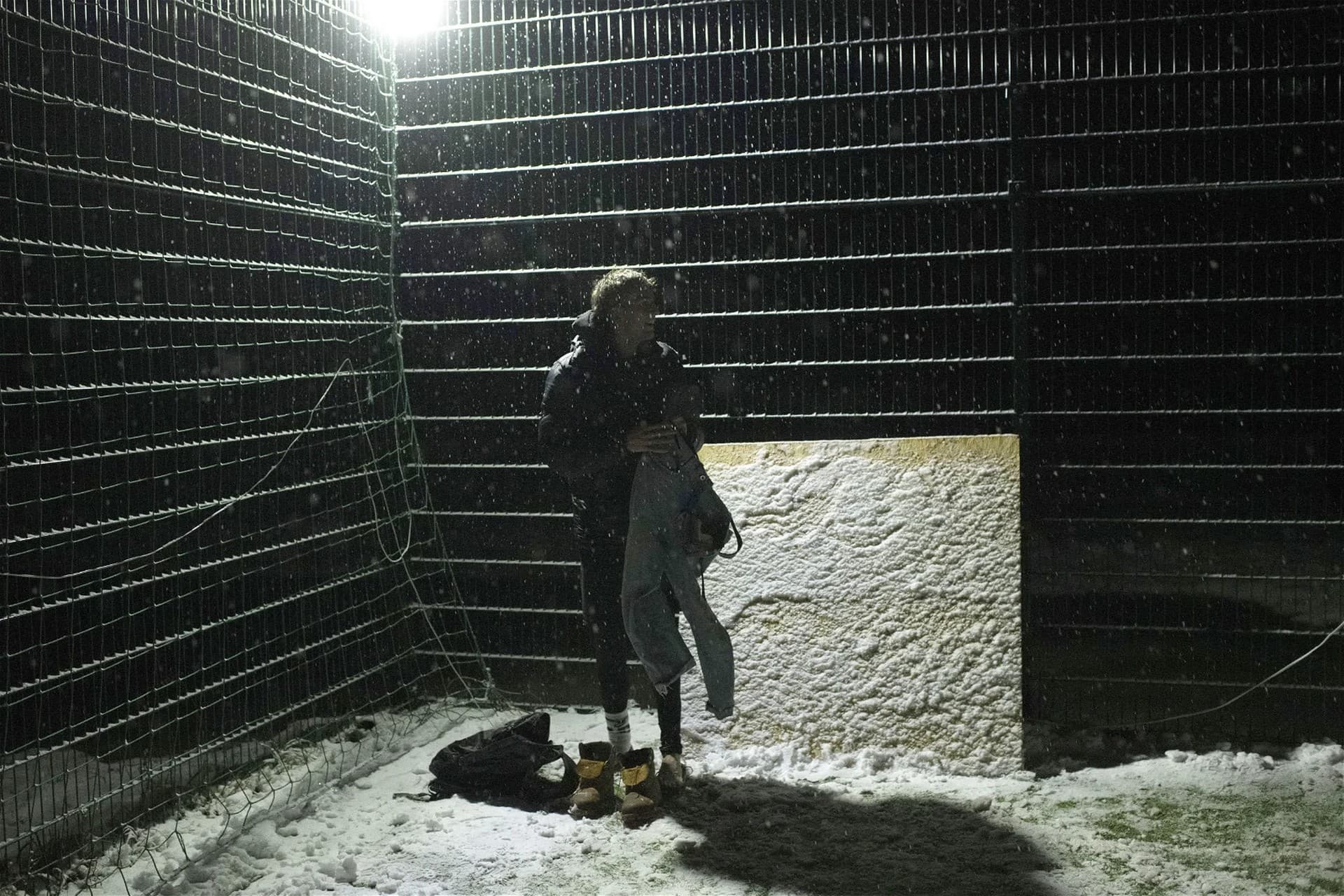 Hlib Kuian changes after a soccer game during a blackout in Irpin