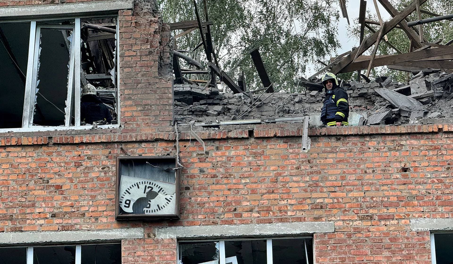 A rescuer works at the site of a hospital damaged during a Russian air strike in Kharkiv, Ukraine