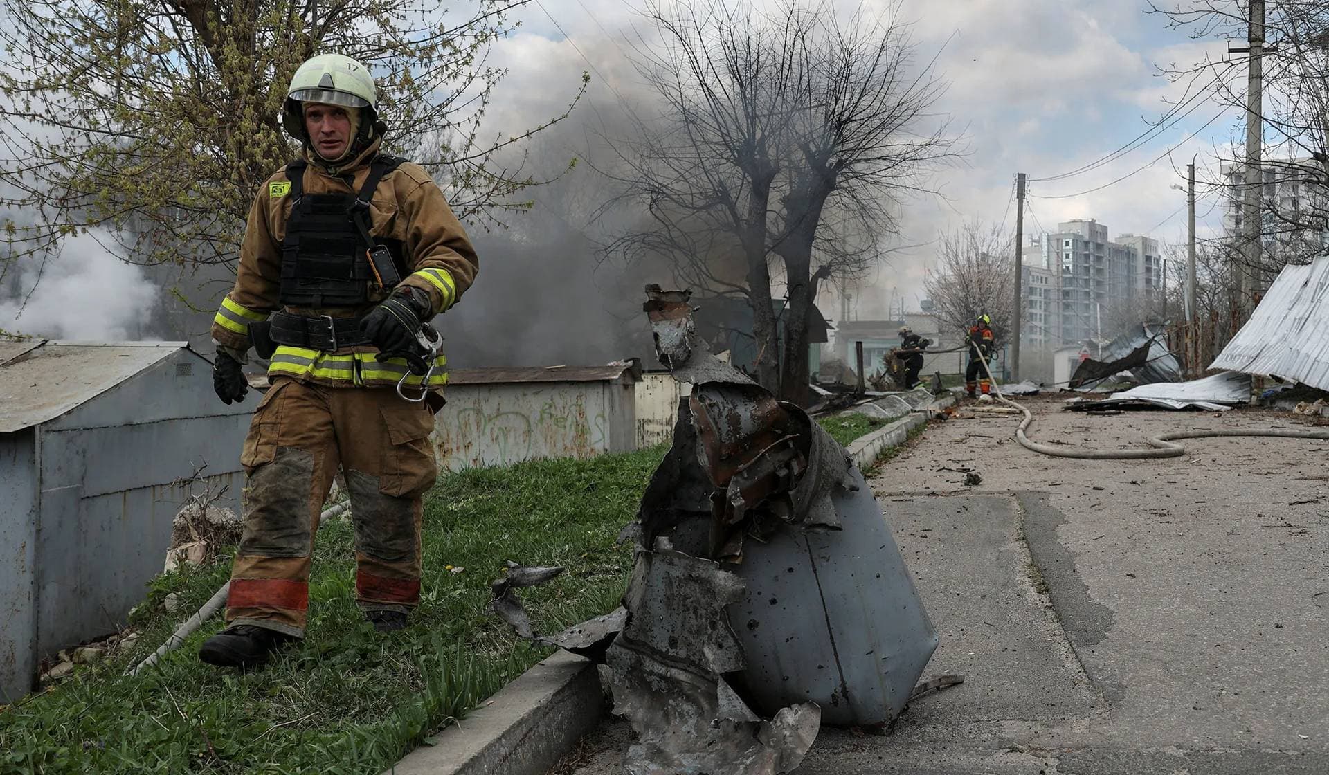 Firefighters work at a site of a Russian air strike in Kharkiv