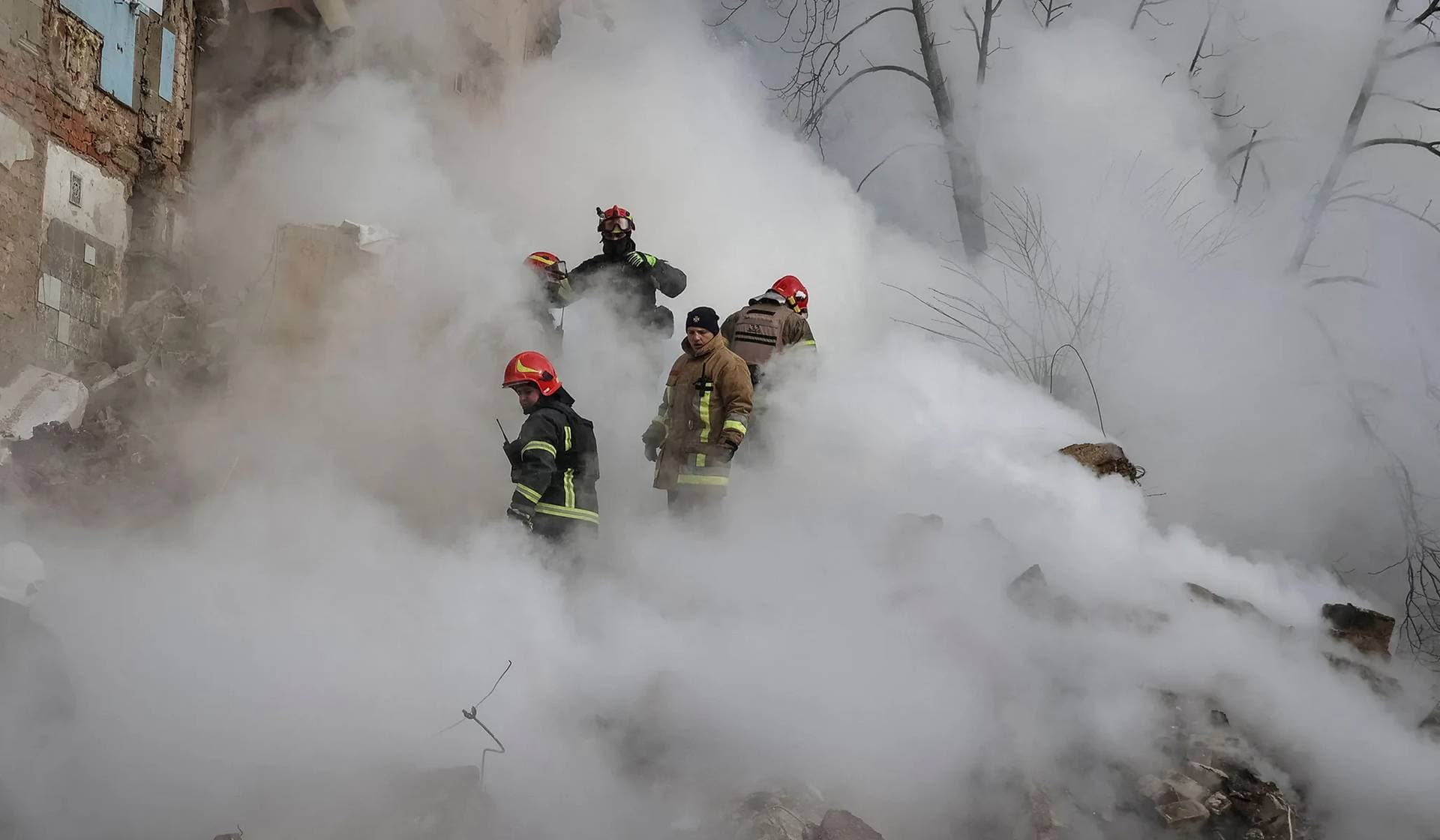Rescuers work at a site of a residential building heavily damaged during a Russian missile attack in Kharkiv