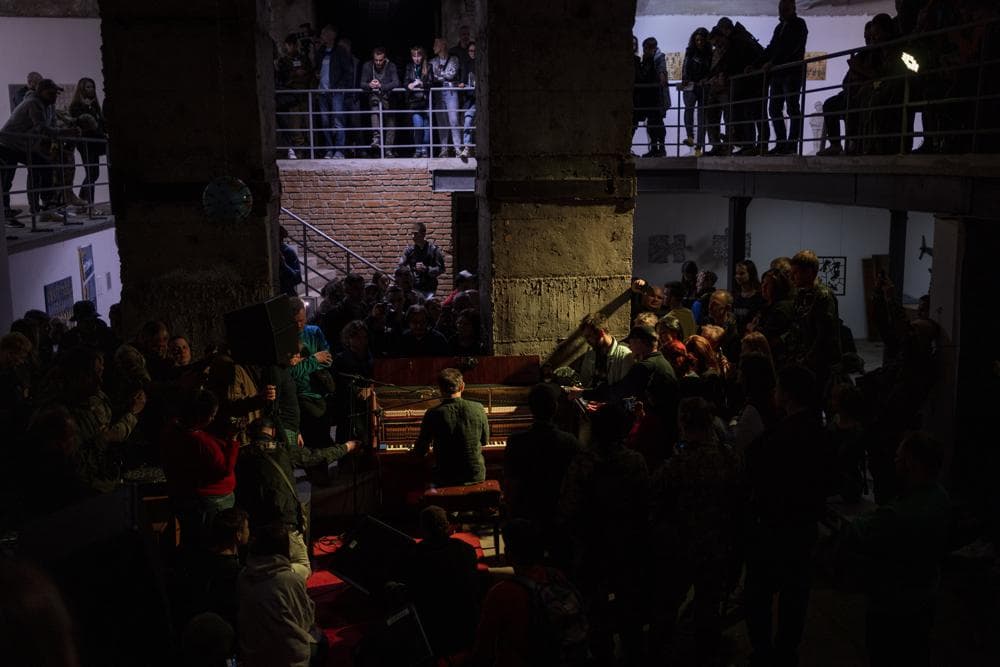 Ukrainian singer Svyatoslav Vakarchuk sings during concert at an art gallery in Kharkiv