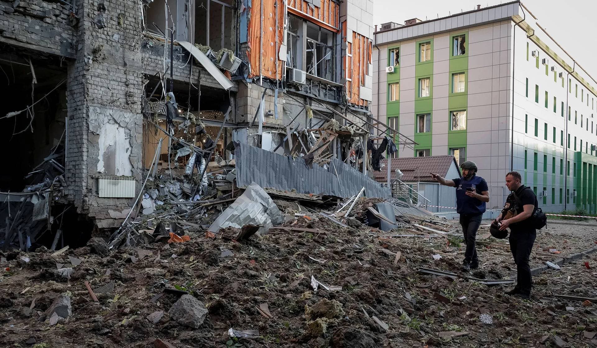 Police work at a site of a Russian air strike in Kharkiv