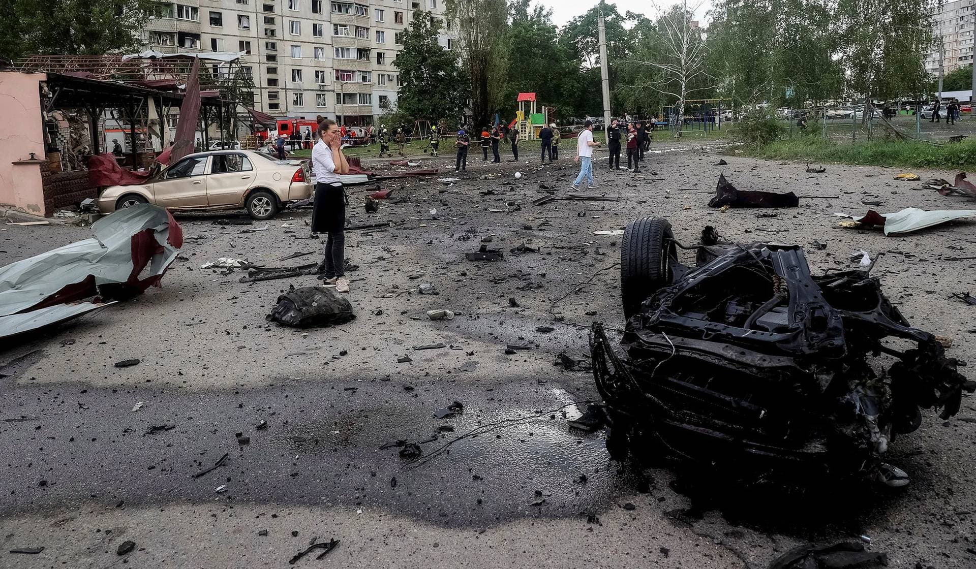 Local resident reacts at a site of a Russian air strike in Kharkiv
