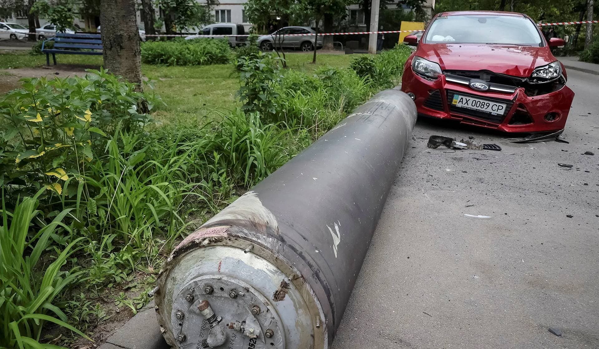 Part of a Russian missile lies at a site near a residential building damaged during a Russian missile attack in Kharkiv