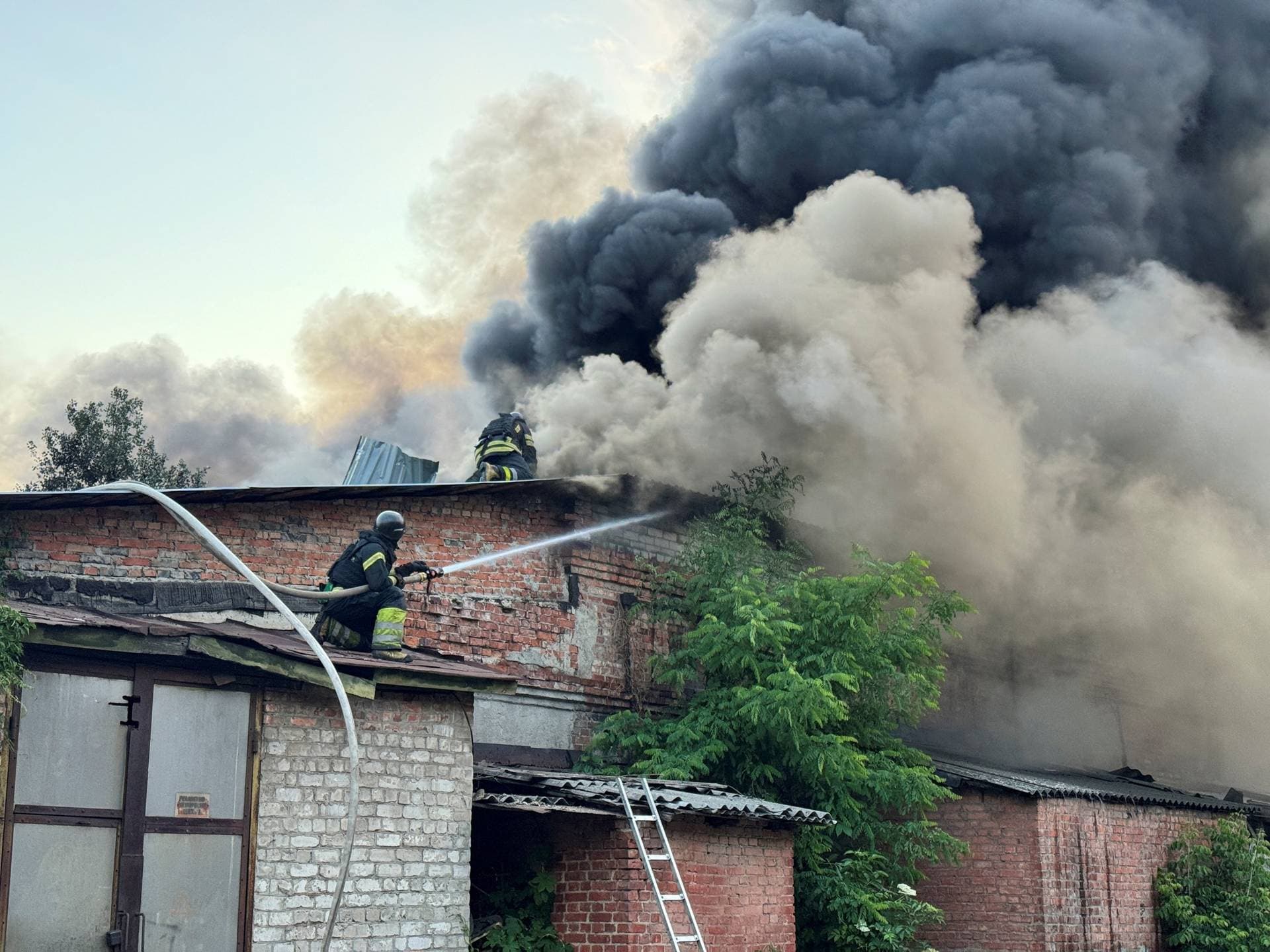 Firefighters work at the site of the Russian drone strike, amid Russia's attack on Ukraine, in Kharkiv