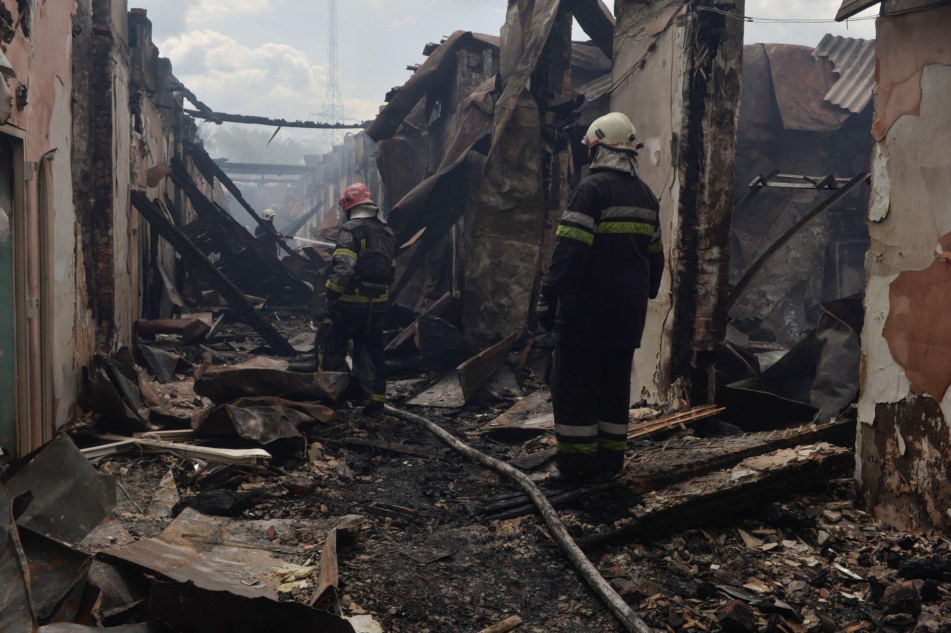 Firefighters work at a site of a professional college that was heavily damaged by a Russian missile strike, as Russia's attack on Ukraine continues, in Kharkiv