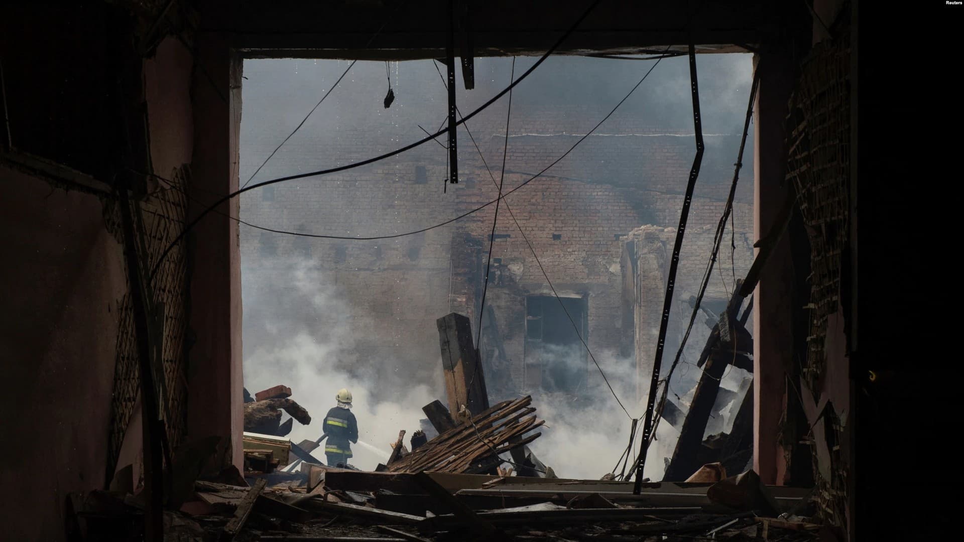 A Ukrainian firefighter works at the site of a vocational college that was heavily damaged by a Russian missile strike in Kharkiv