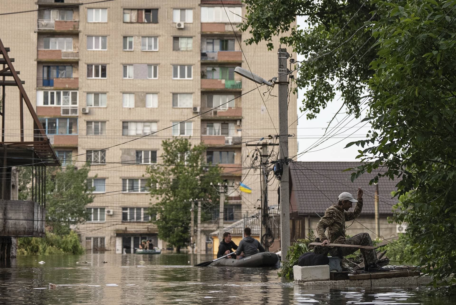 A man gets to his flooded house in Kherson