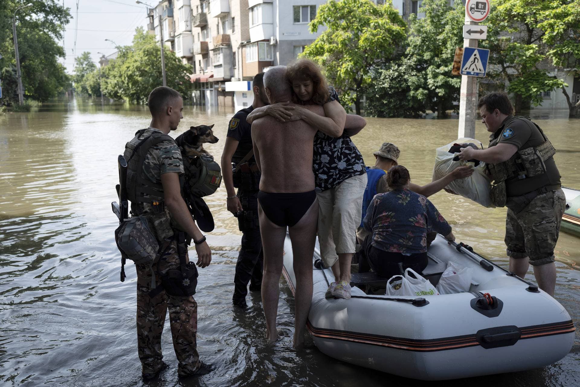 Residents are evacuated from a flooded neighborhood in Kherson