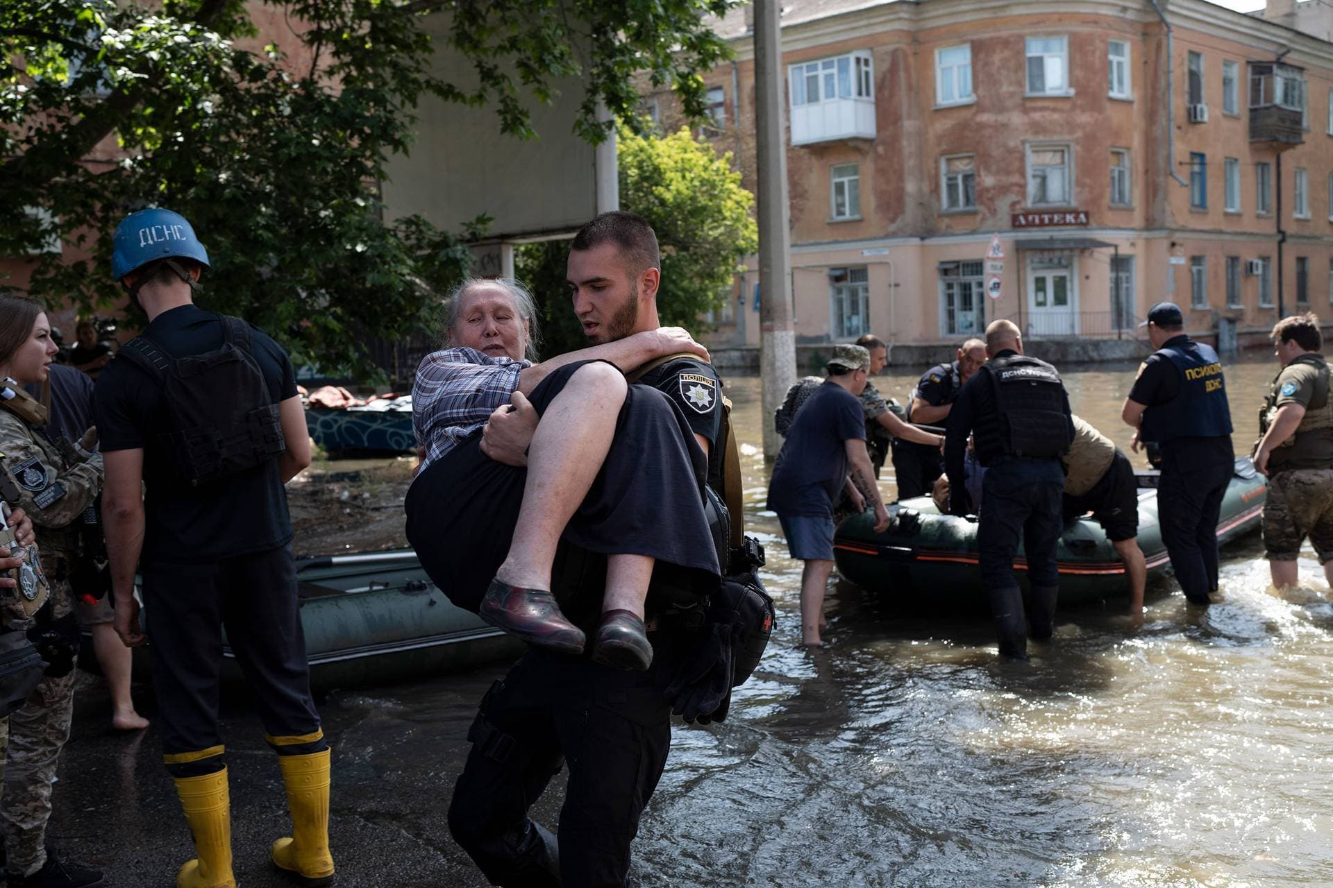 Residents are evacuated from a flooded neighborhood in Kherson