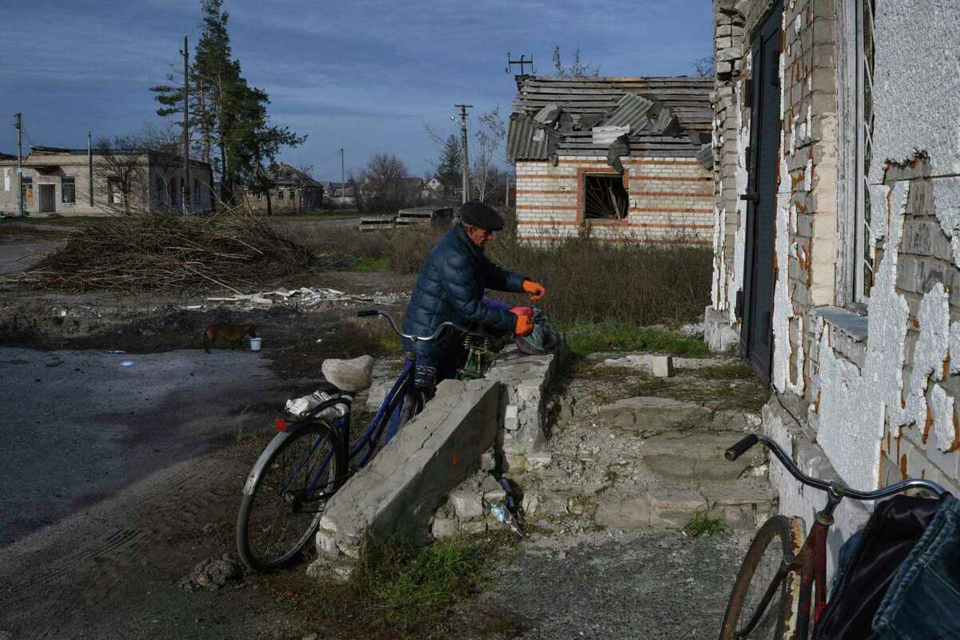 A local resident receives a food at a mobile humanitarian aid point in the village of Zarichne