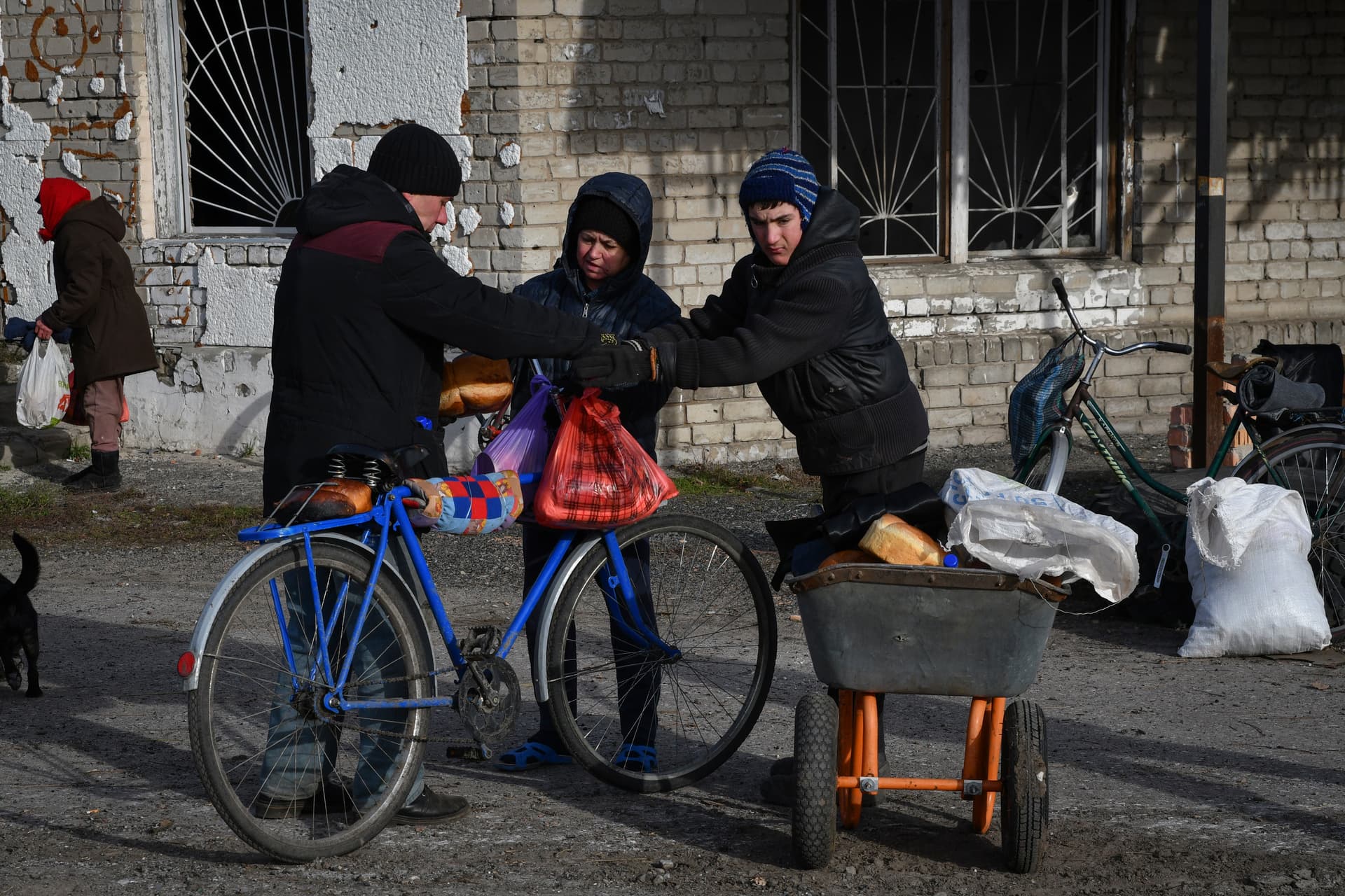 Local resident receive a food at a mobile humanitarian aid point in the village of Zarichne