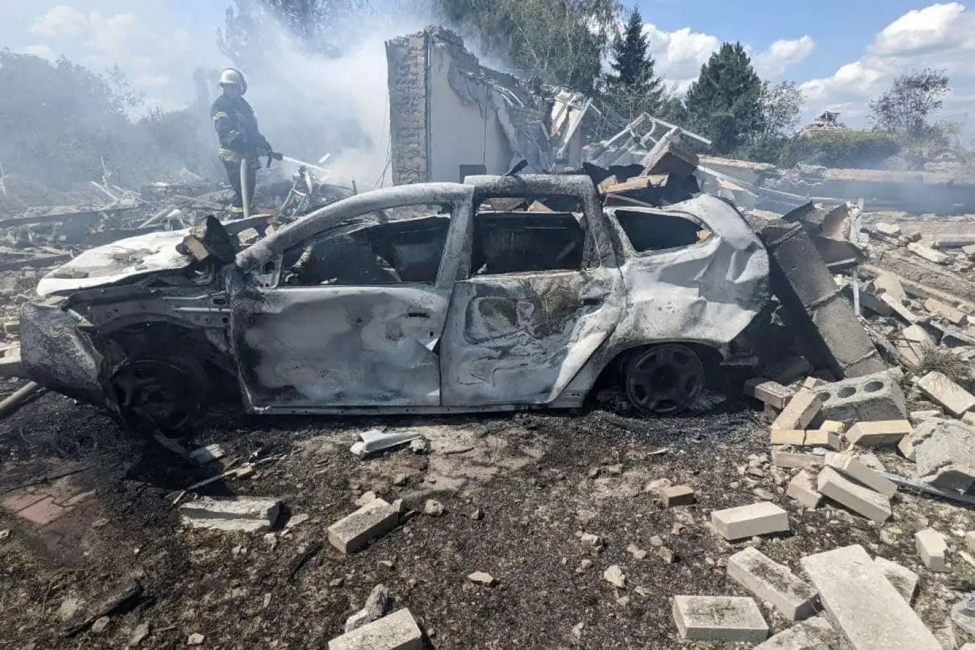 A firefighter works in a residential area damaged by a Russian missile strike in Kramatorsk