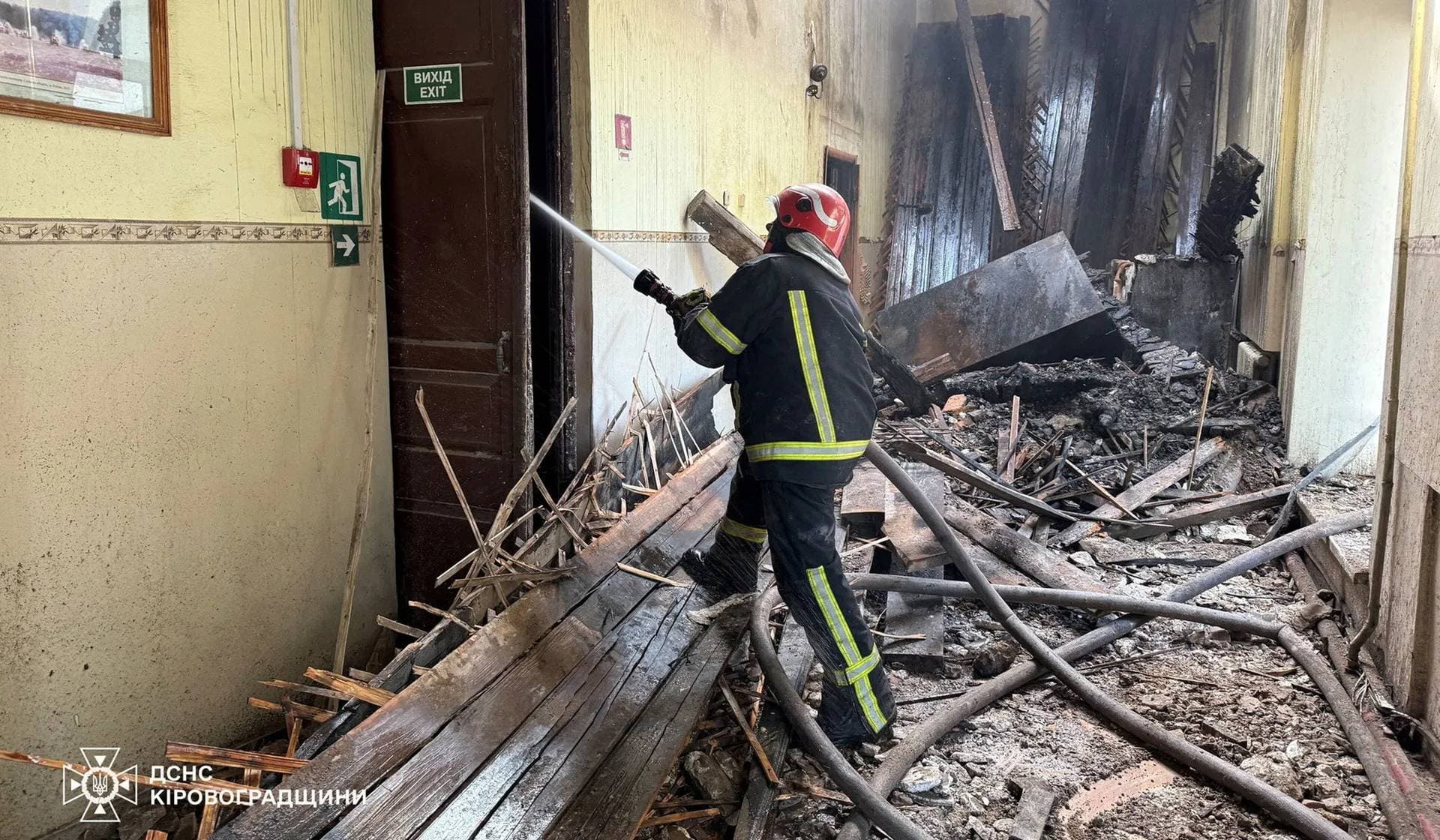 Firefighters work at the site of the headquarters of the special purposes emergency rescue squad that was hit by a Russian drone strike in Kropyvnytskyi