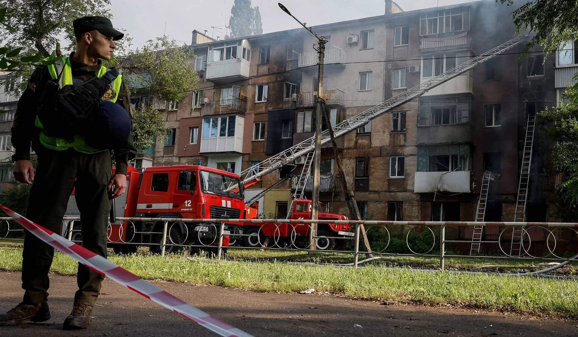 Rescuers work at a site of a residential building heavily damaged by a Russian missile strike in Kryvyi Rih