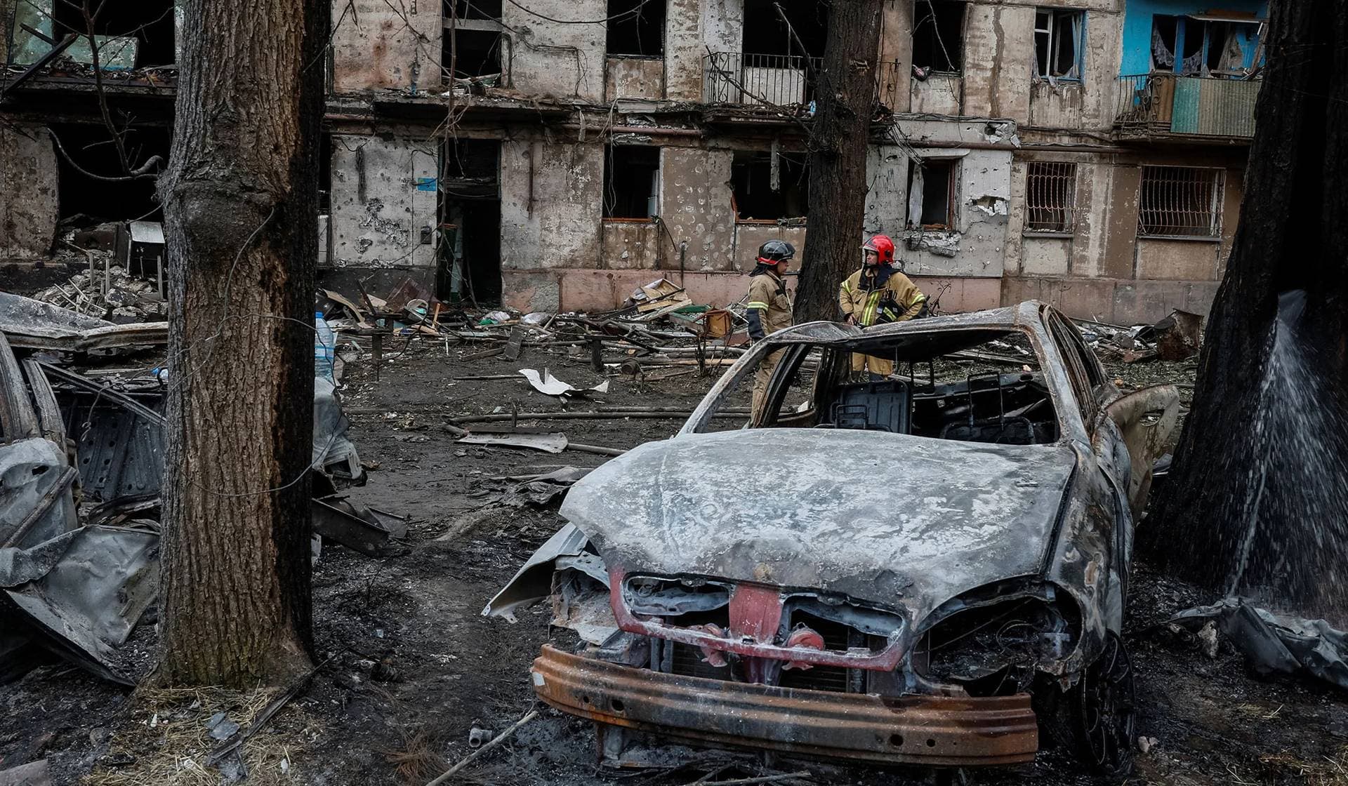 Rescuers work at a site of a residential building heavily damaged by a Russian missile strike in Kryvyi Rih