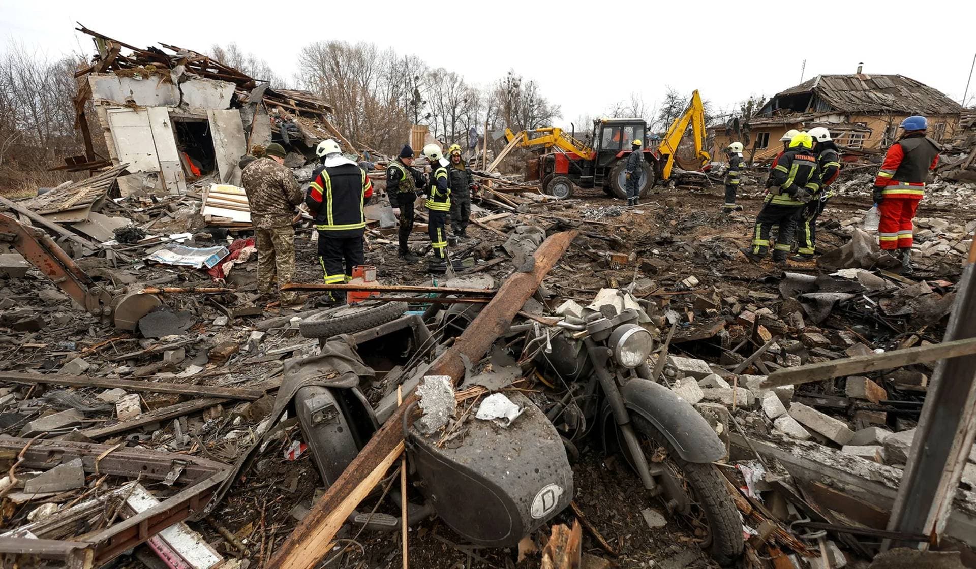 Rescuers work at a site of a residential house damaged during a Russian missile strike in Kyiv
