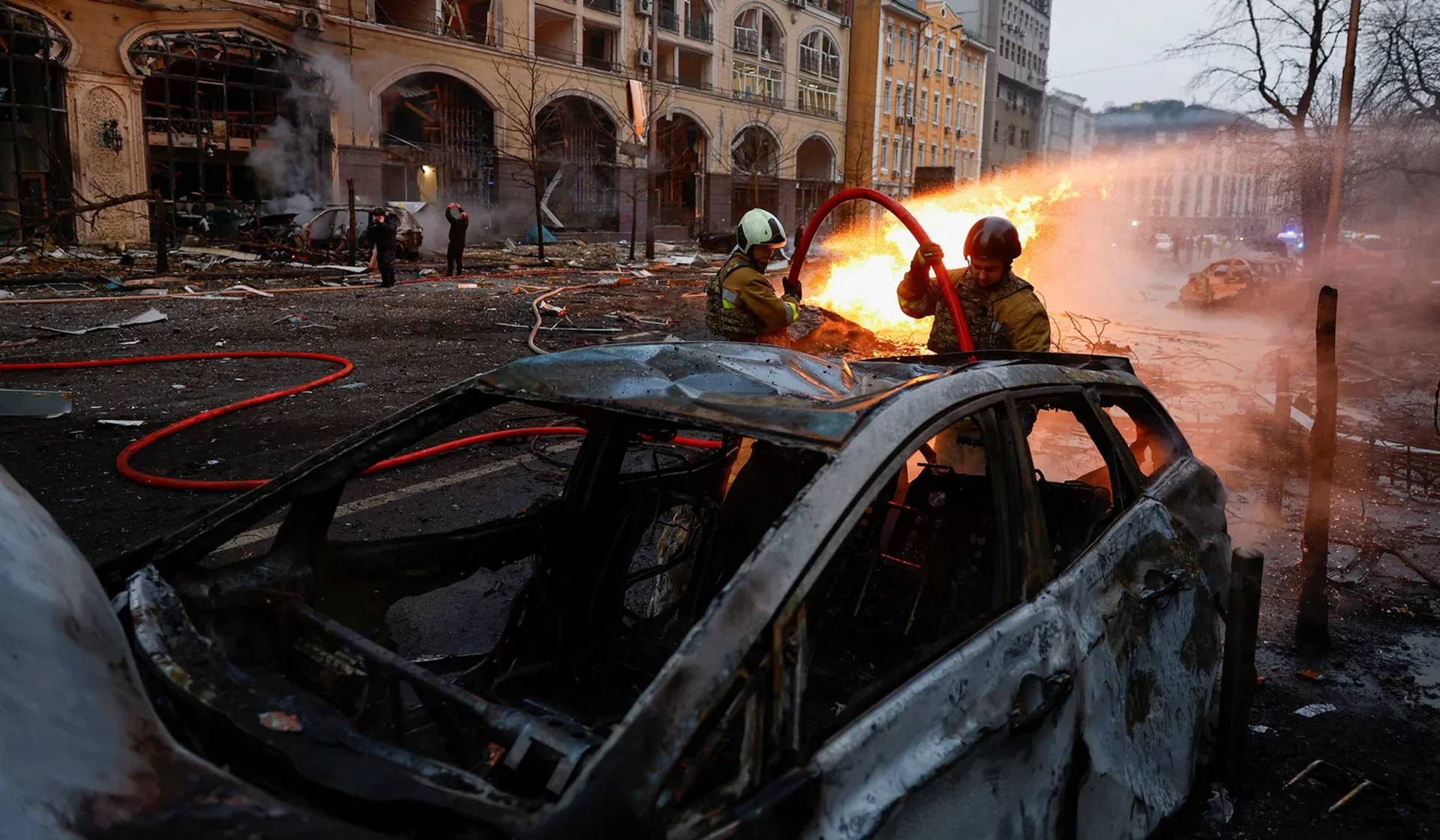 Rescuers work at the site of a building destroyed during a Russian missile strike in central Kyiv