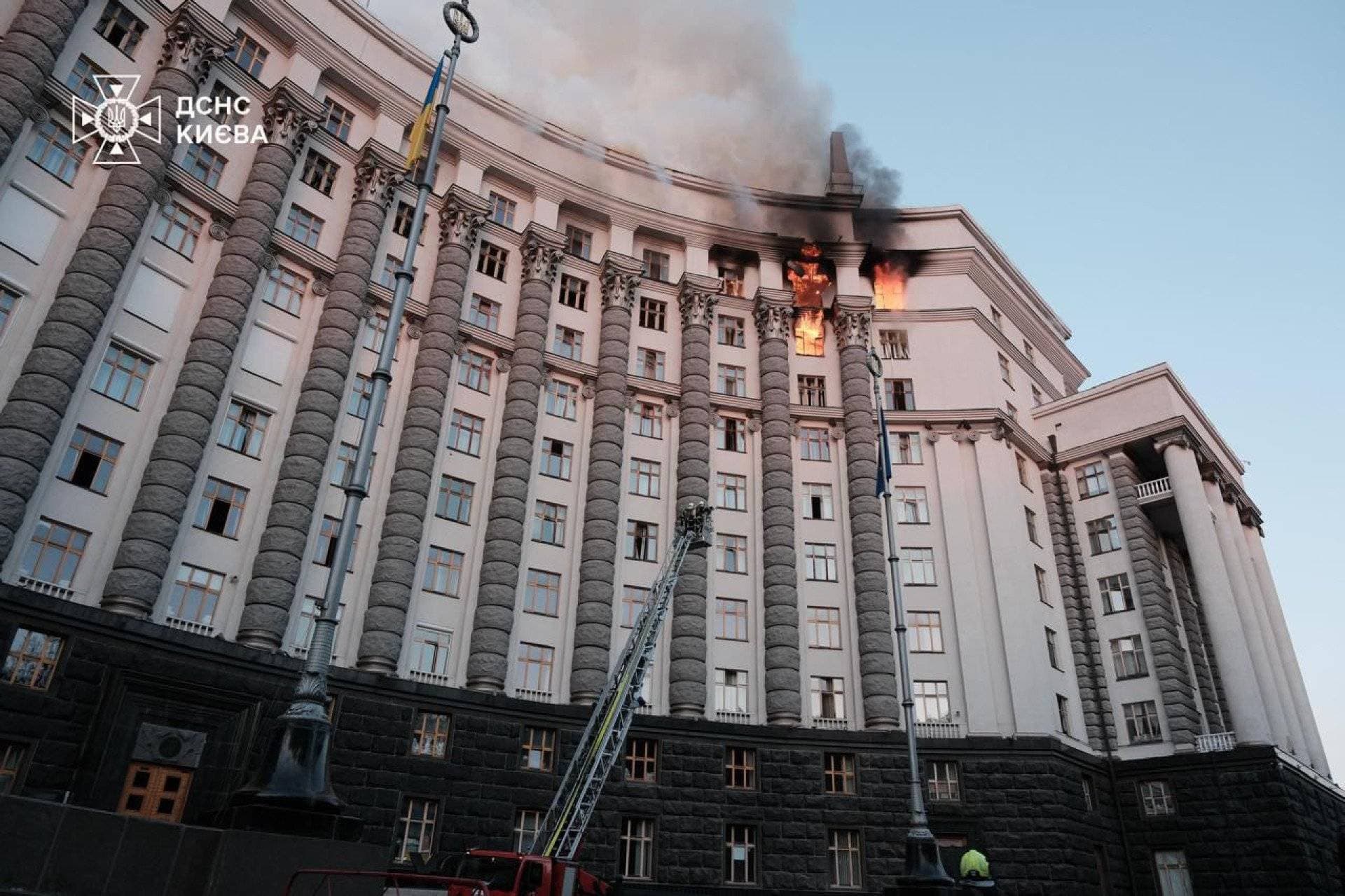 Firefighters work at the site of a headquarters building of the Ukrainian government damaged during Russian drone and missile strikes in Kyiv