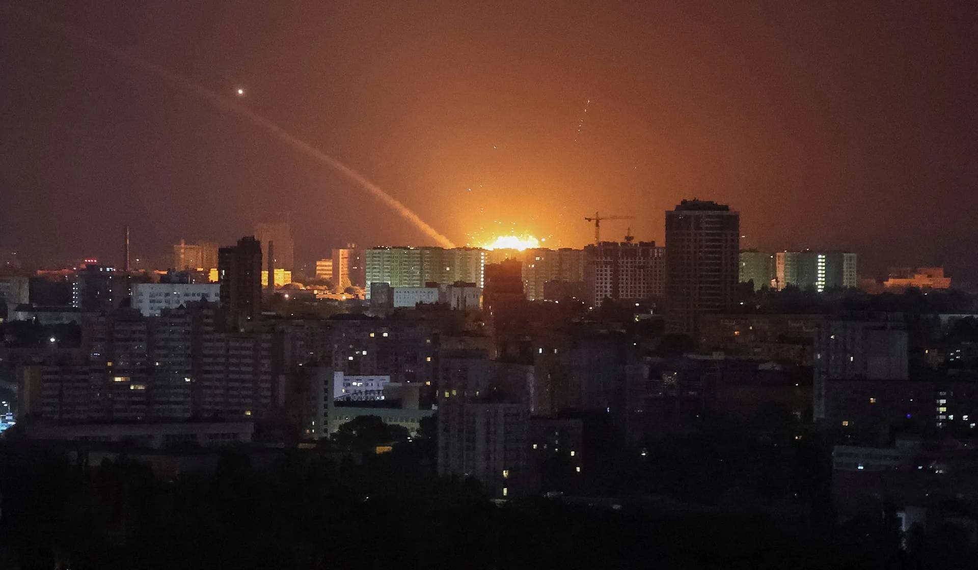An explosion after a Russian missile strike in the sky over the city during a Russian missile attack in Kyiv